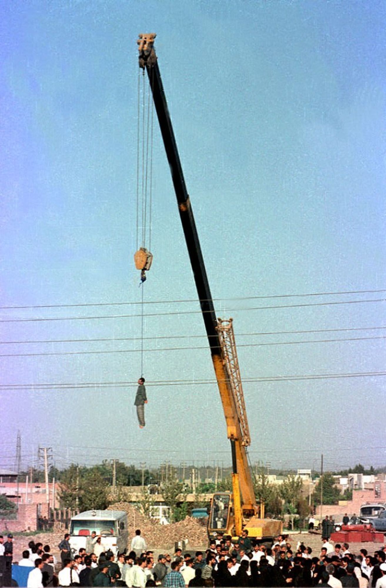 Man is hanged on a crane on Iran as capital punishment for being a homosexual