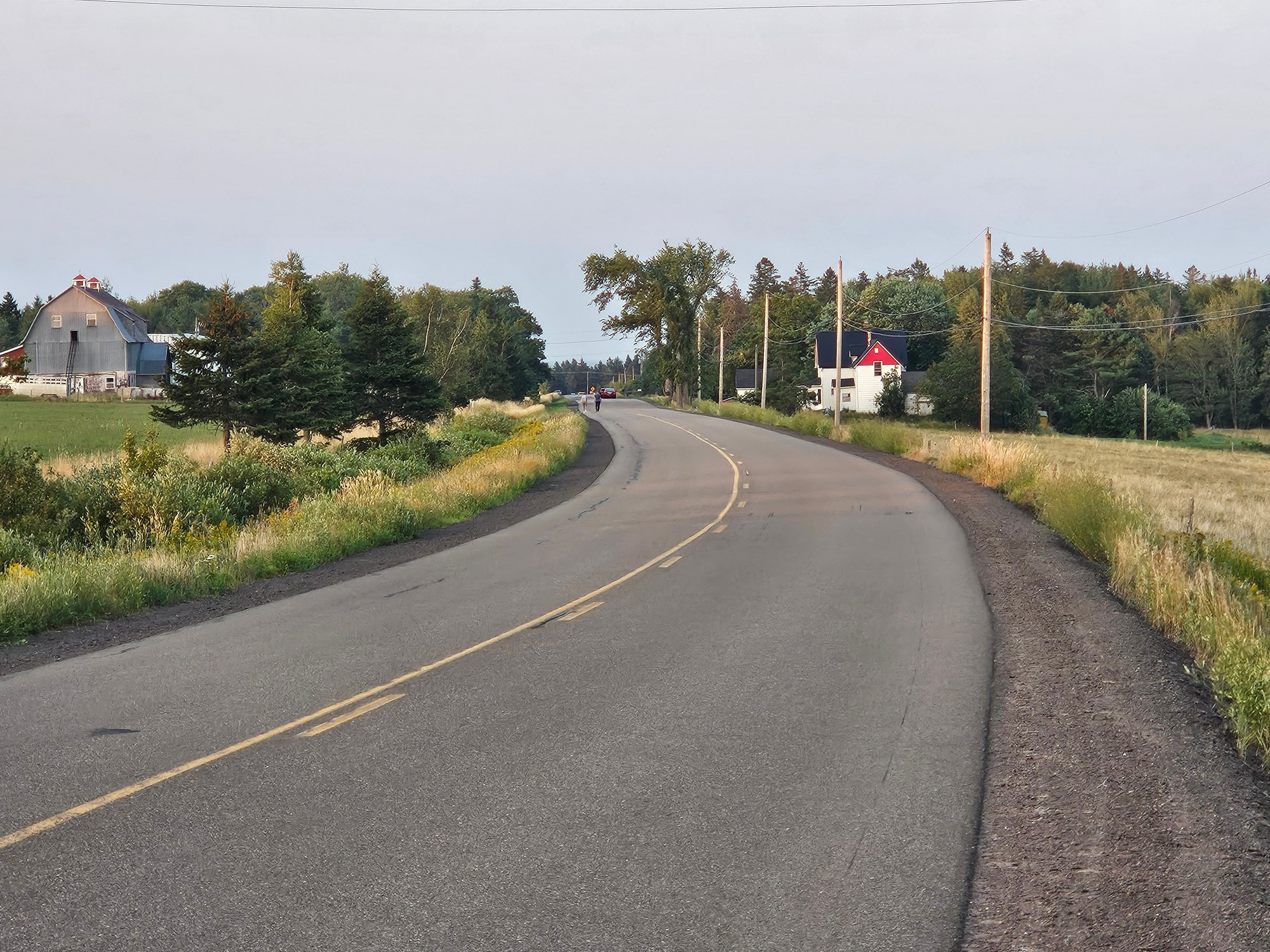 The Indian Mountain Road. There are people walking & cars parked looking at the forest fire to the southeast. 
