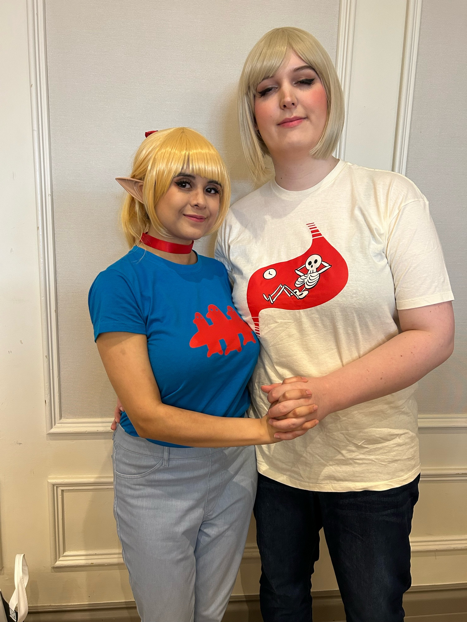 my wife and i in Farcille cosplay. we’re specifically cosplaying the casual/modern versions from one of Ryoko Kui’s Daydream Hour artbooks, featuring fun t-shirts and jeans.