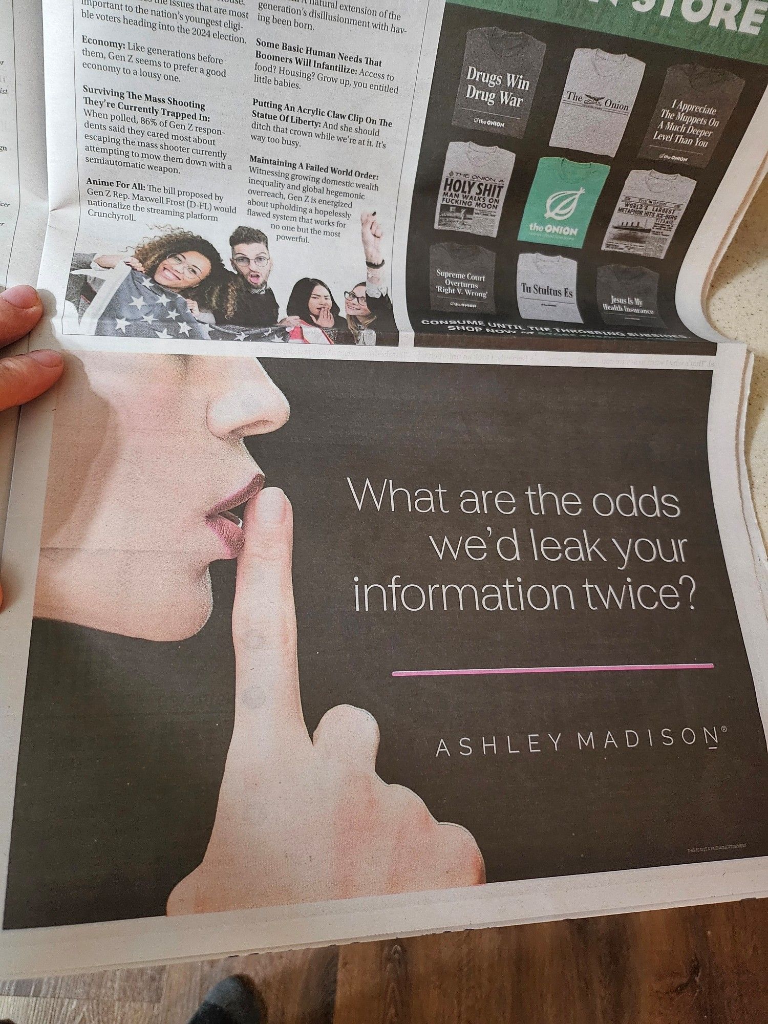 Fake print ad with a hand shushing a woman's lips. The headline is "what are the odds we'd leak your information twice?" With the brand name Ashley Madison.