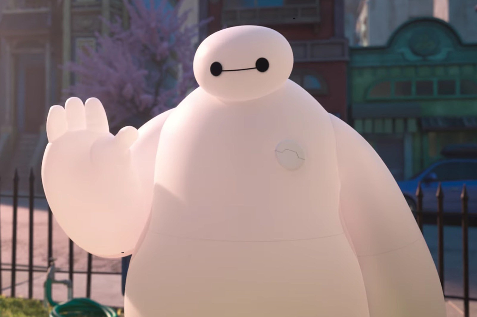 Baymax from Big Hero 6 raising his hand to wave at someone