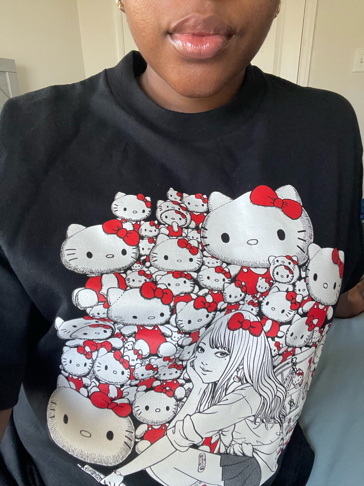 Bluesky user MadamZeti is wearing a black t-shirt from the Hello Kitty X Junji Ito collaboration 