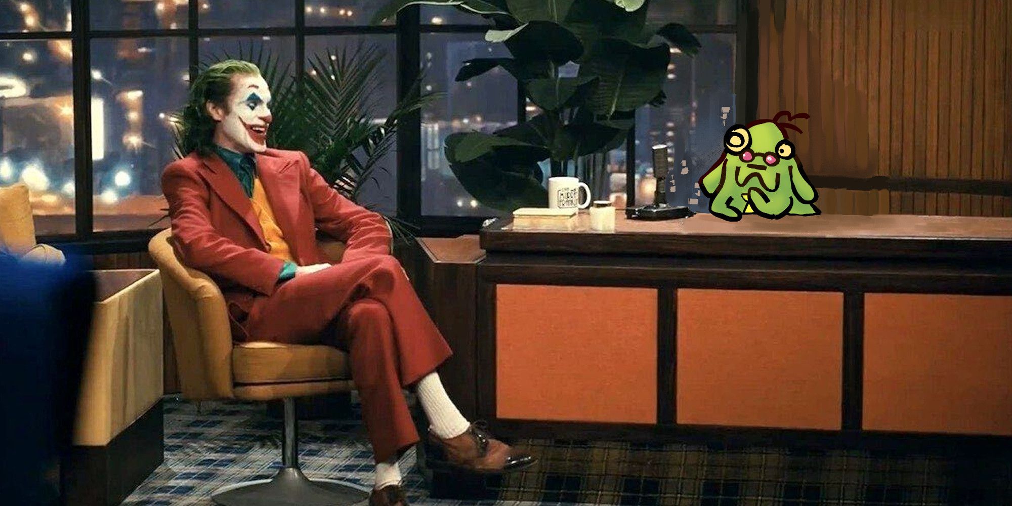 A screenshot from the Joker film with a green dog in a yellow tie and glasses sitting in the hosts place