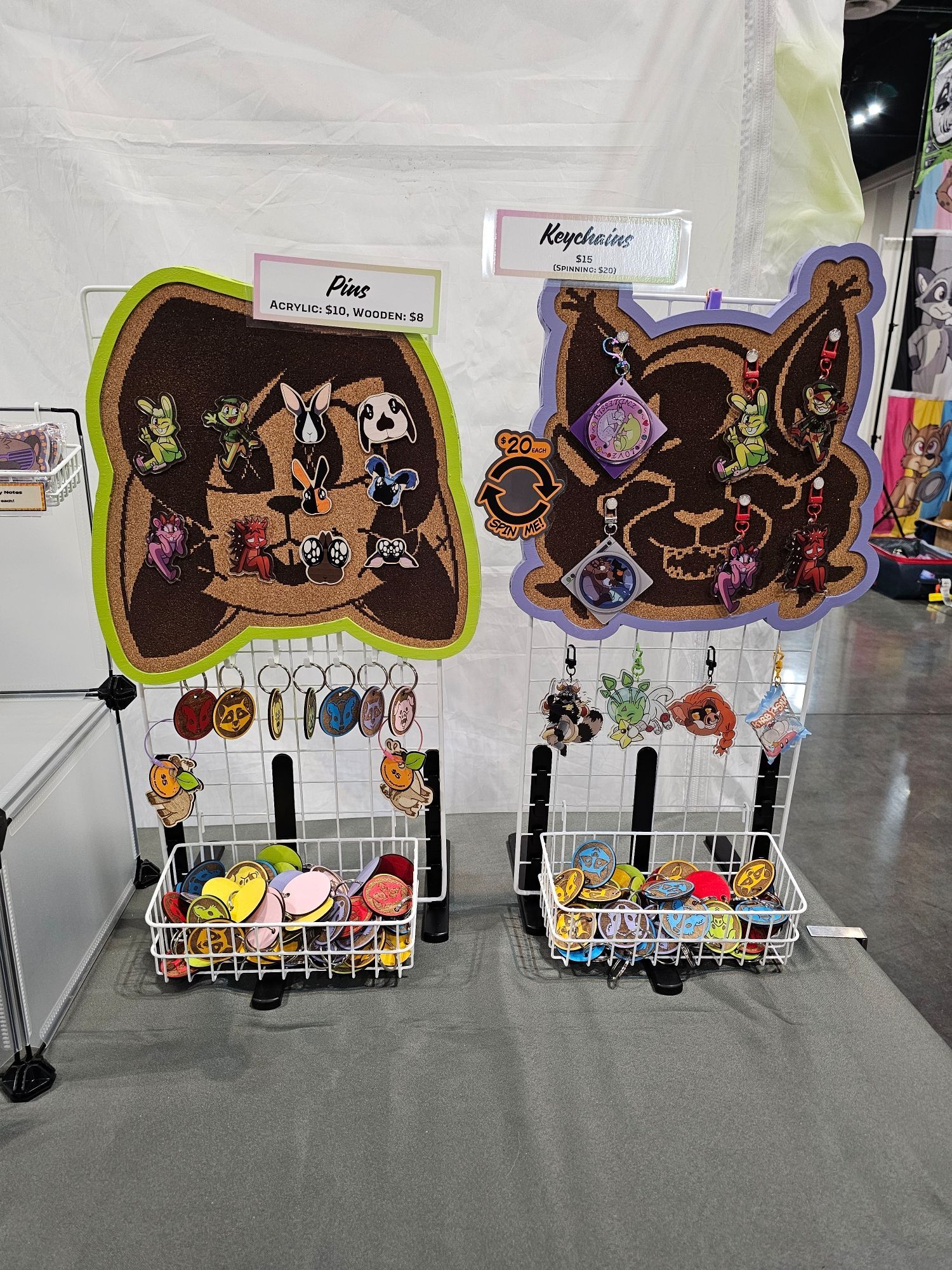 Pins and charms, shaped like rabbits, happy tree friend characters, and more, all hanging from corkboards and wire frame displays!