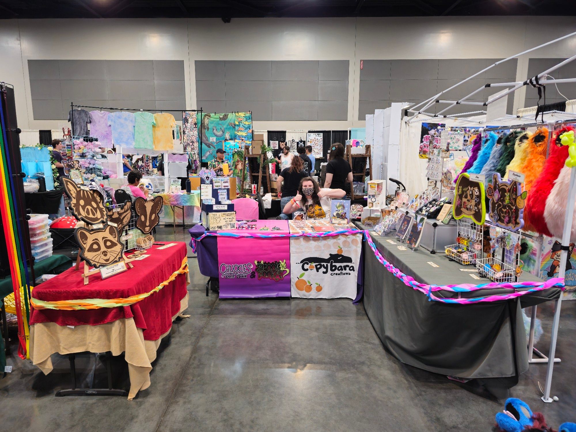 Our AFC Booth representing Copybara Creations, Spooky Pooka, and Chuckles Thee Lynx (me), featuring pins, charms, corkboards, stickers and more!