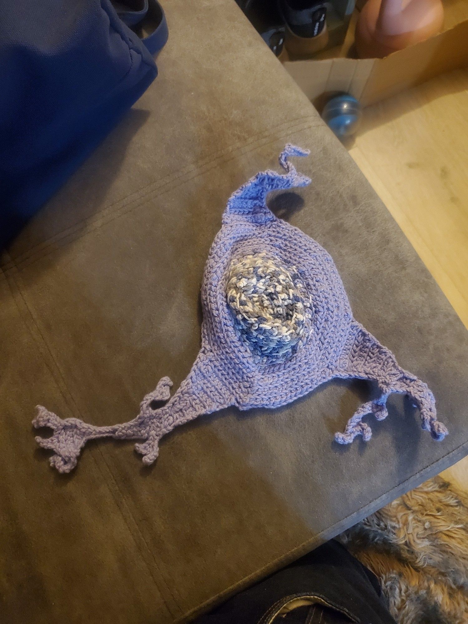 Crocheted lavender brain cell with a blue grey and white nucleus