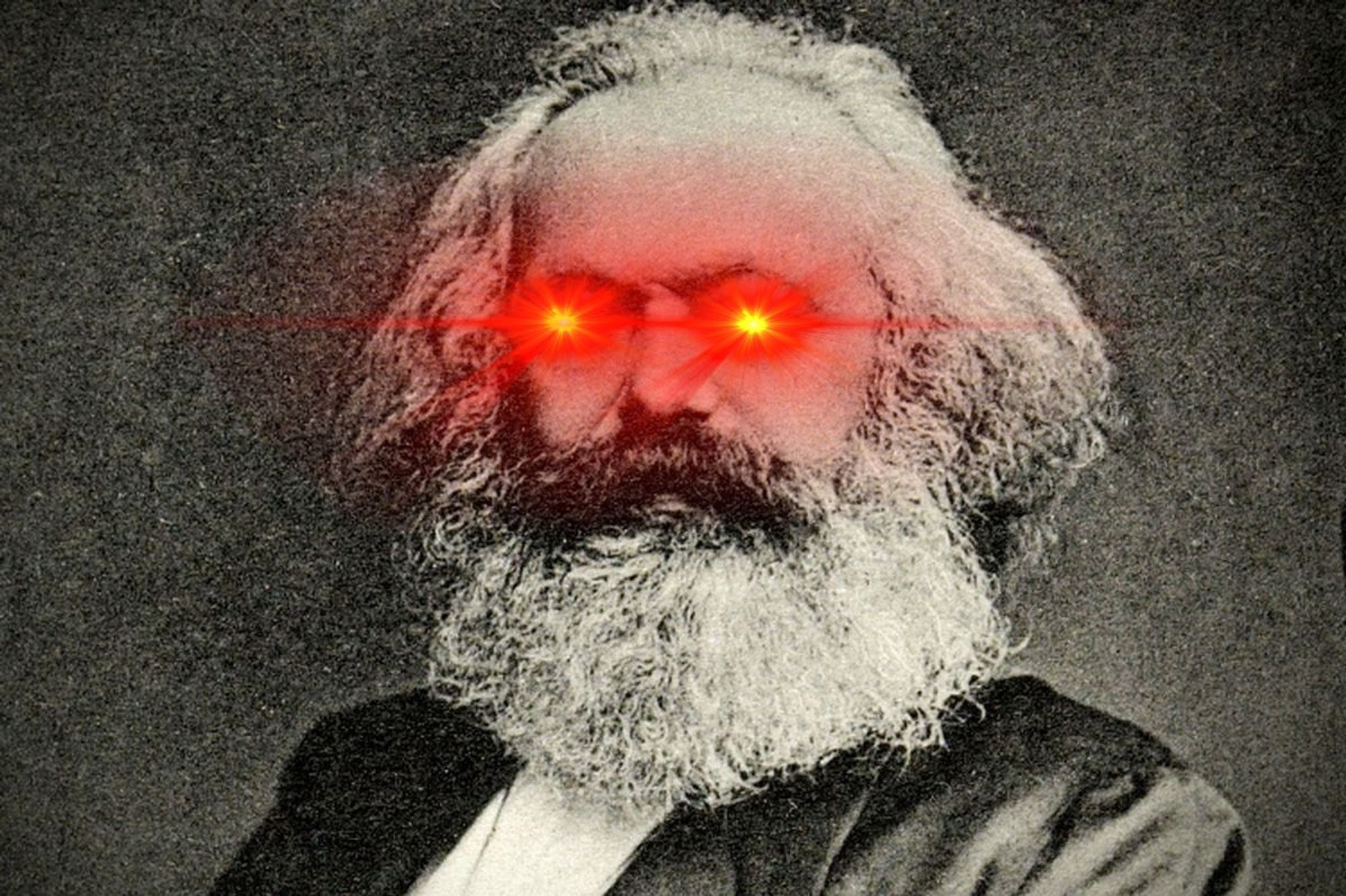 Grainy B&W portrait of Karl Marx with red laser eyes (meme)