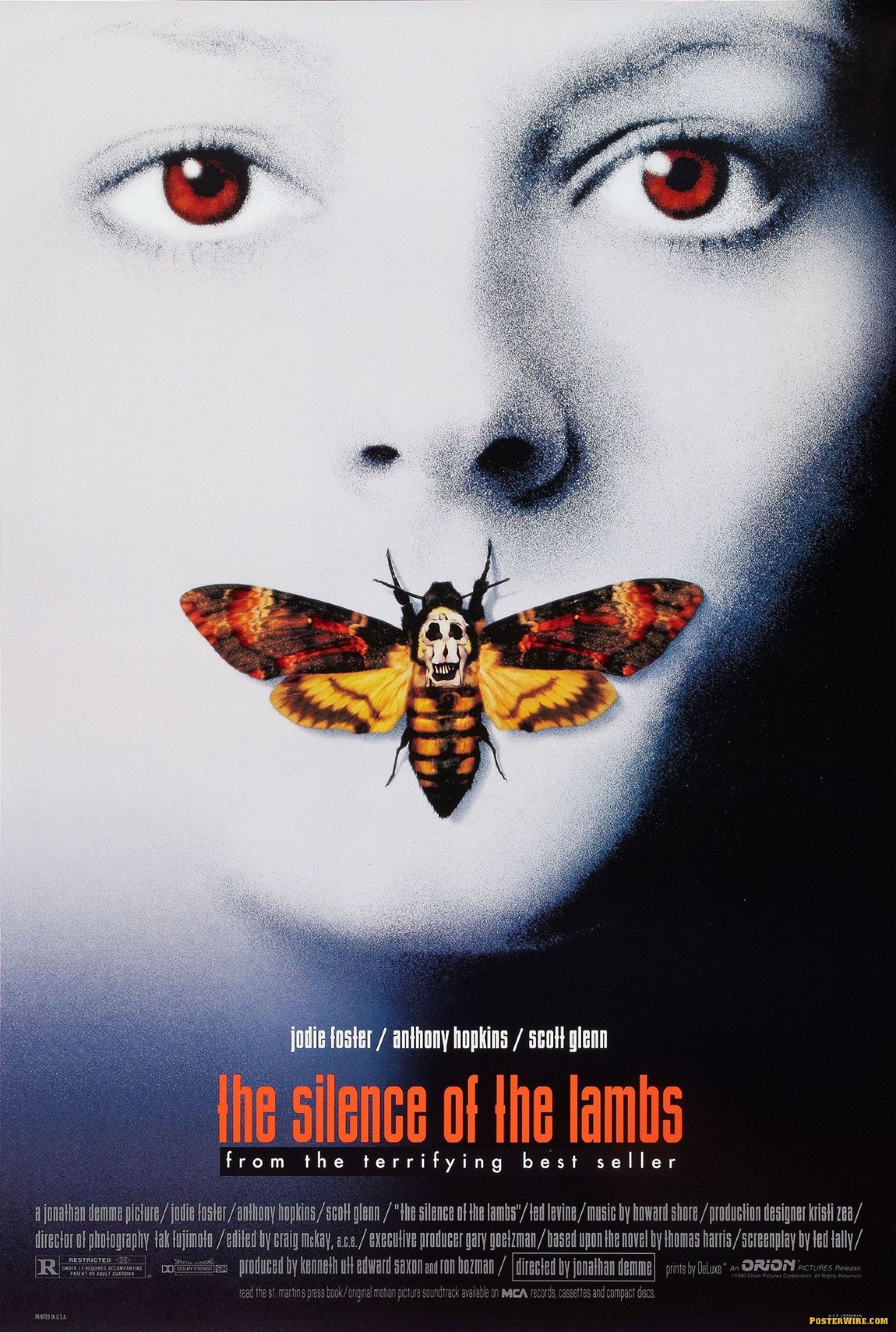 Poster to the Jonathan Demme 1991 film “The Silence of the Lambs,” based on the novel by Thomas Harris. The poster is dominated by an over-exposed, deathly white image of Clarice Starling’s face (played by Jodie Foster), eyes open and colored a deep red; her mouth is concealed/sealed by a “death’s head moth”. Credits beneath her chin list Foster, Anthony Hopkins (Lecter) and Scott Glenn (Jack Crawford), and beneath it, in a lighter, more orange-red, the title of the film. Beneath that, “from the terrifying best seller”.