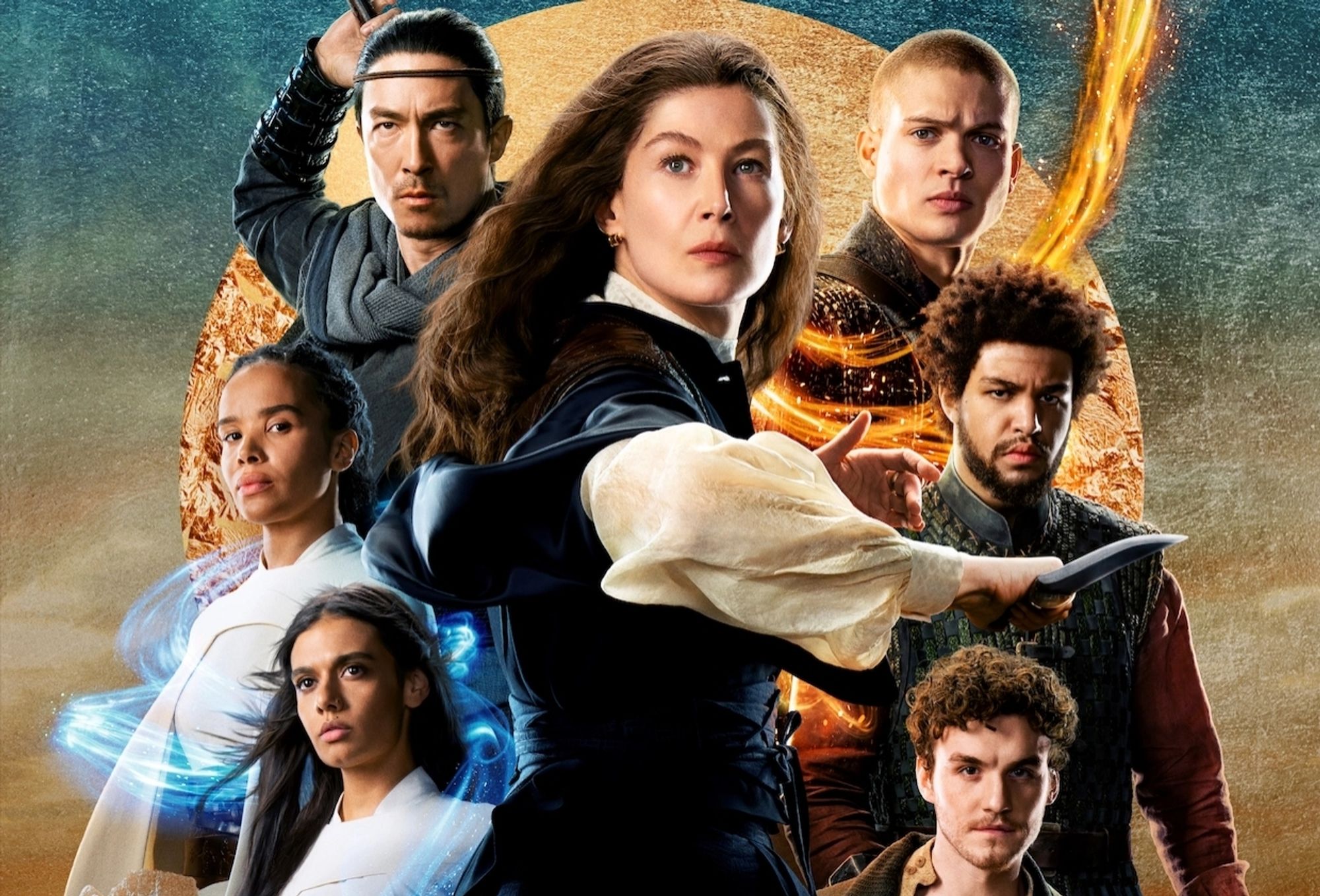 A poster for wheel of time season 2 a fantasy TV show. There are five younger crew members flanking two older more experienced fighters. Everyone is devastatingpy beautiful 
At the center is a white woman with long hair in a blue dress and white sleeves holding a knife, alongside her companion and Asian man drawing a sword from behind his back. To the right are three men, a white man with short red hair, a brown man with curly dark hair and beard, and a white man with curly dark hair. To the left are two brown women in white dresses with long black hair