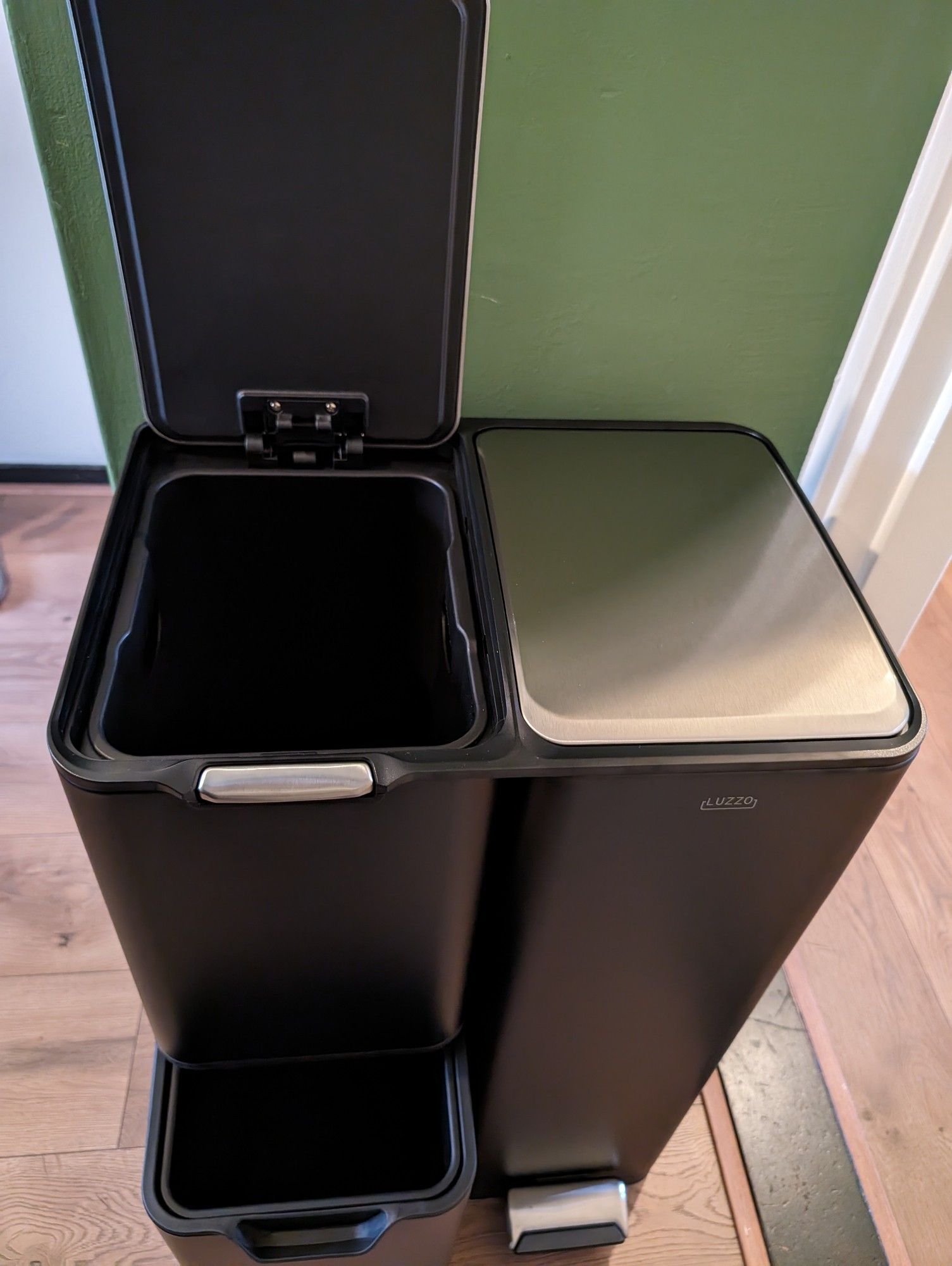 A bin with two smaller ones on the left side, one of which slides out, and a large pedal bin on the right