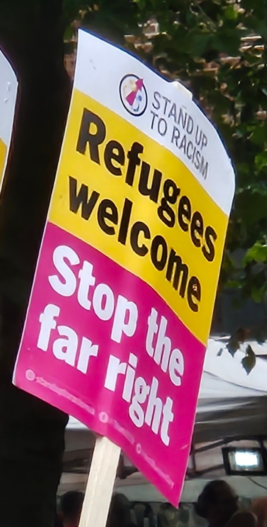 Stand up to Racism placard saying "Refugees Welcome. Stop the Far Right"