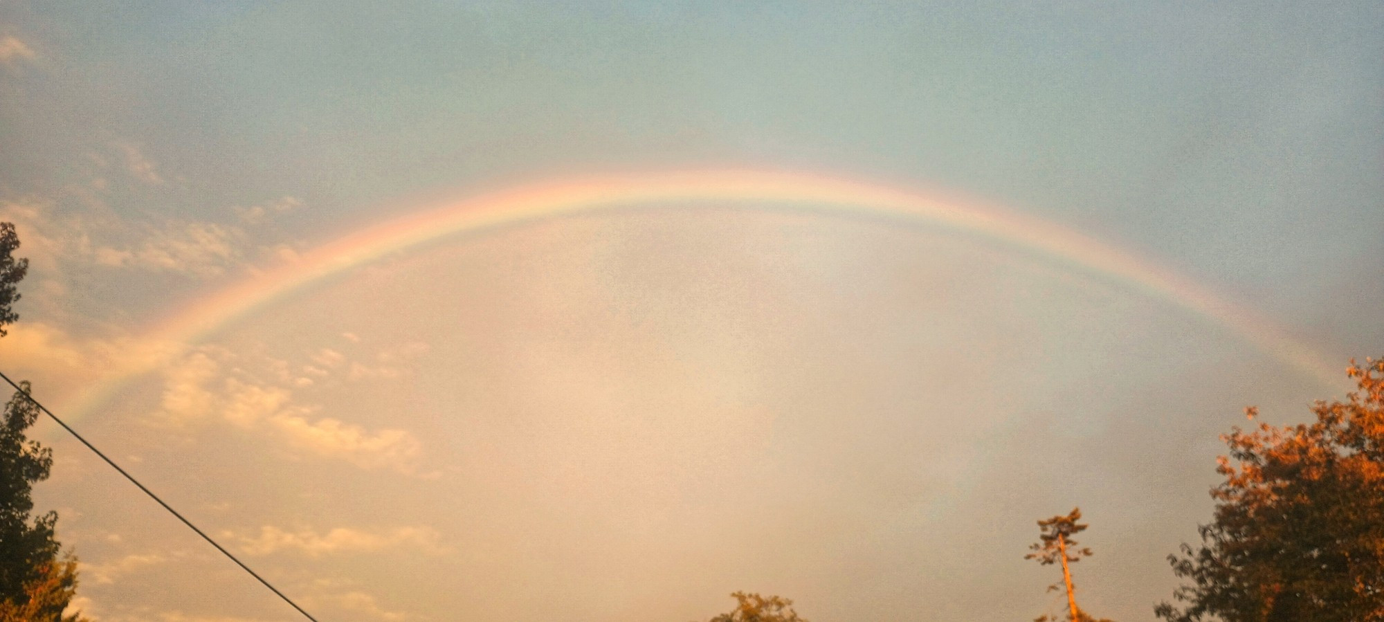 full rainbow all across the whole sky