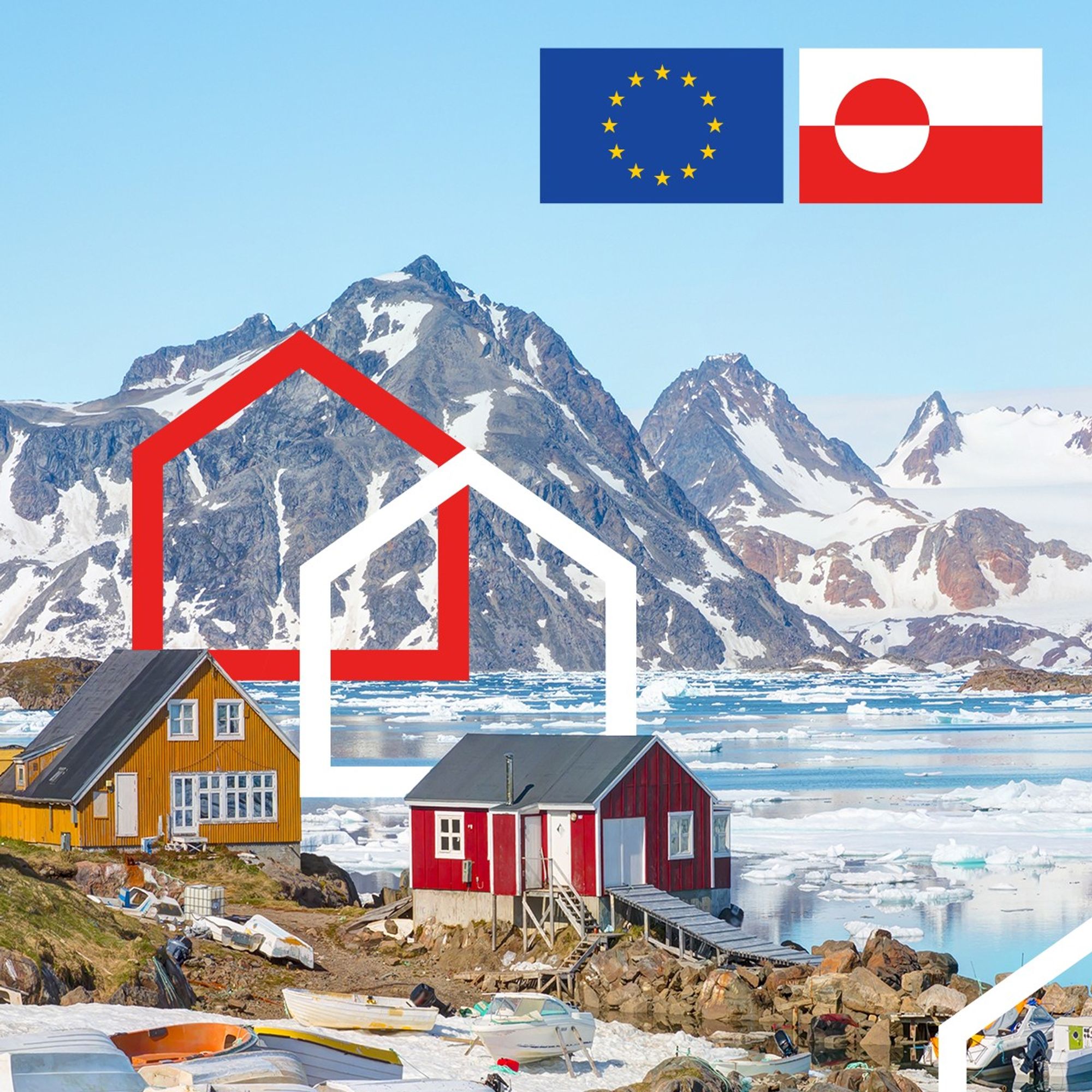 A view of two colourful houses in the Kulusuk village, East Greenland. In the backdrop is a partially frozen harbour and mountains.