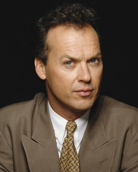 michael keaton in a light brown suit yellow tie and white shirt. short brown hair. looking at you like: i'm batman.

"if you act now, you get a free demon possession with every exorcism.”