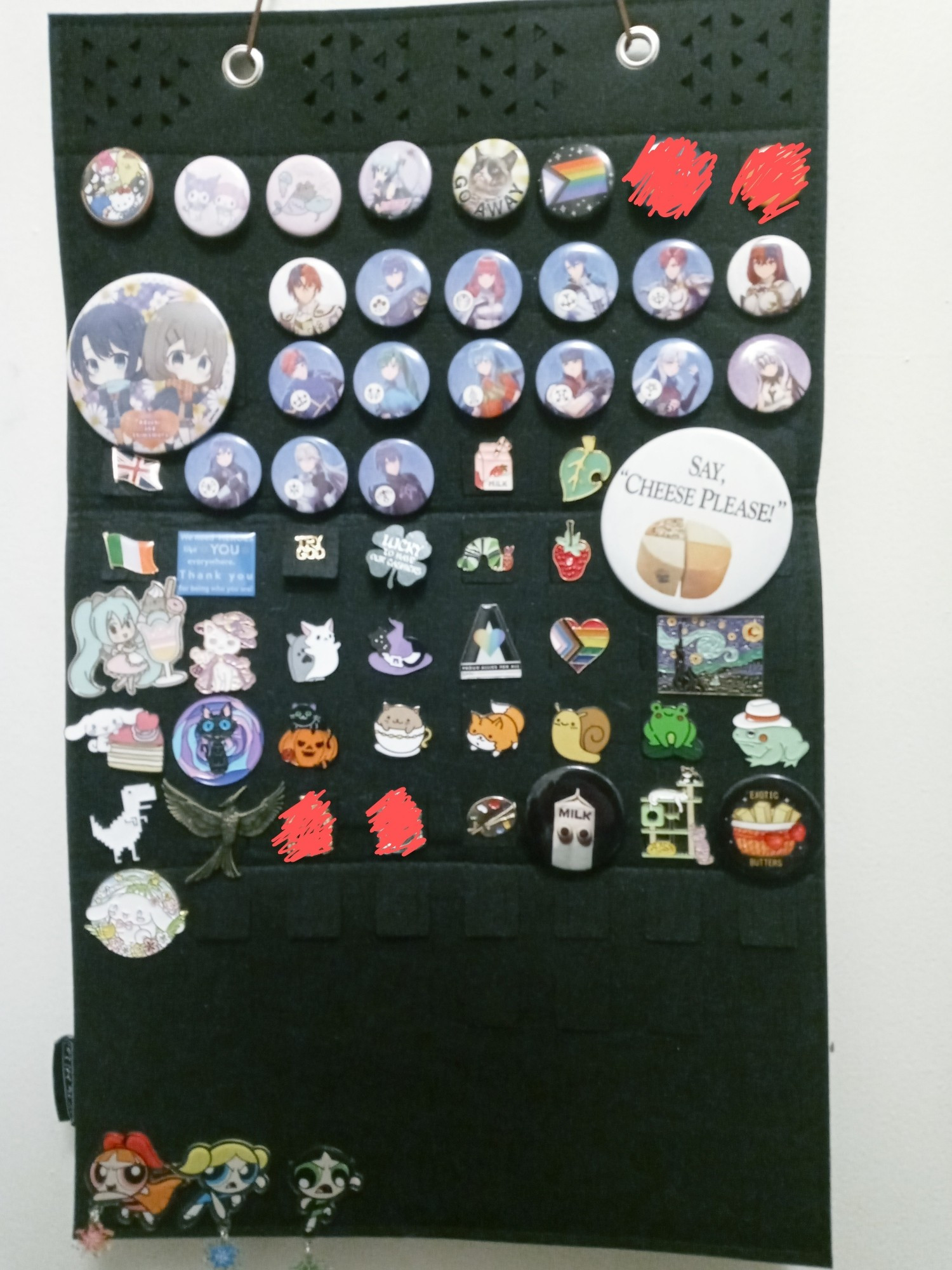 Picture of my pin collection. Some are scribbled out to avoid doxxing but the rest are mostly Fire Emblem, anime, or cute related pins.