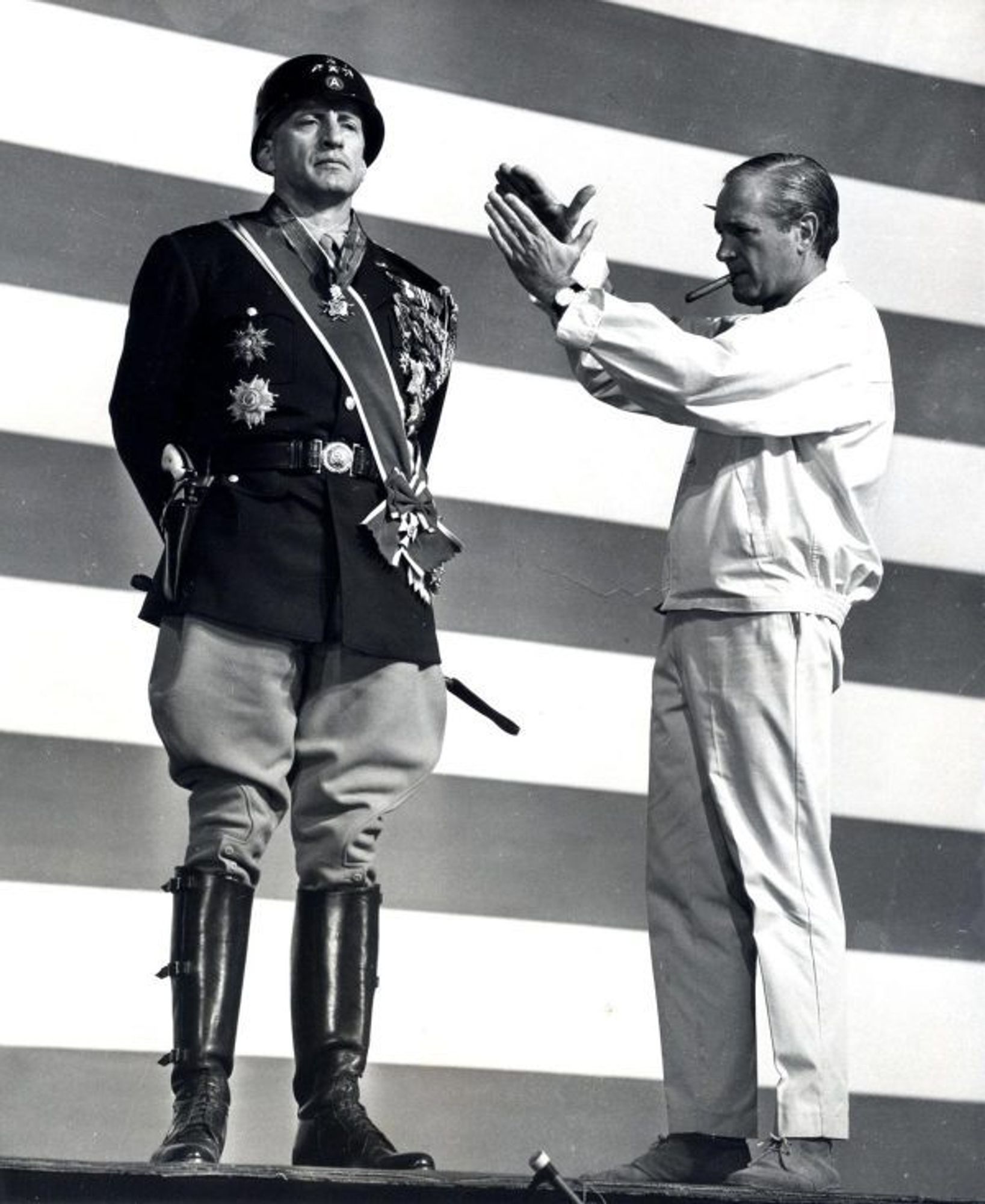 Franklin J. Schaffner and George C. Scott in front of big flag