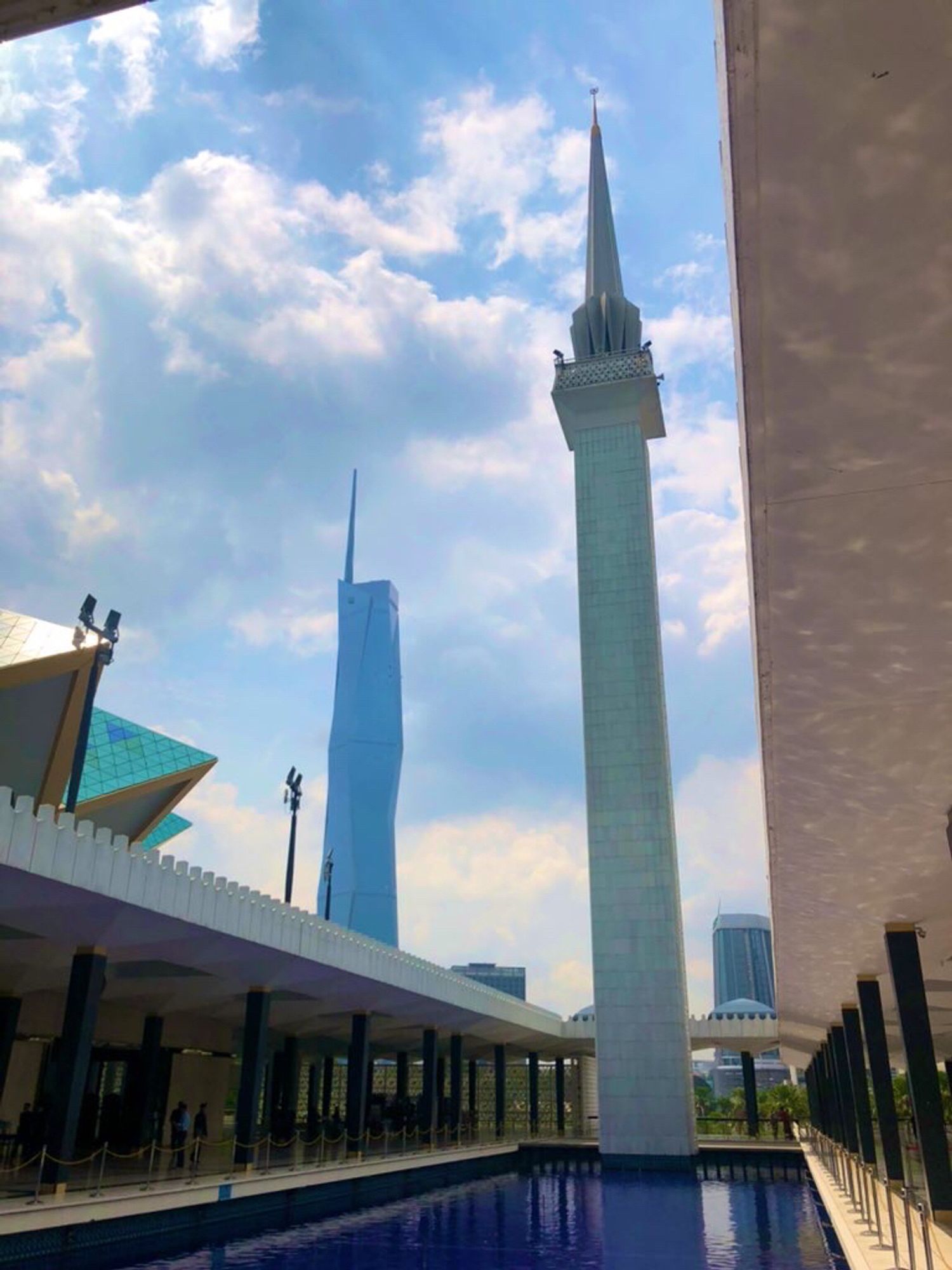 View of National Mosque minaret and Warisan Merdeka Tower in the background. 