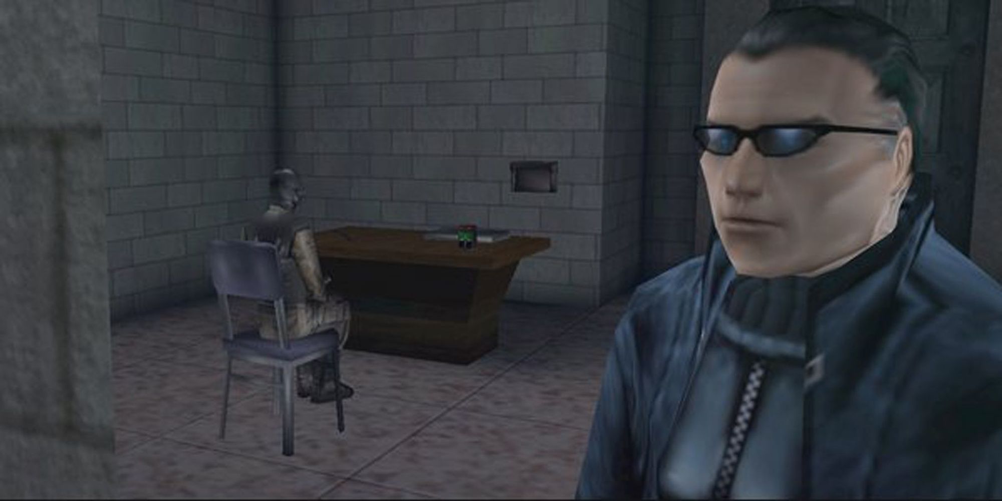 A screenshot of Deus Ex where JC Denton is looking off camera and there is a terrorist sitting on a chair behind him.