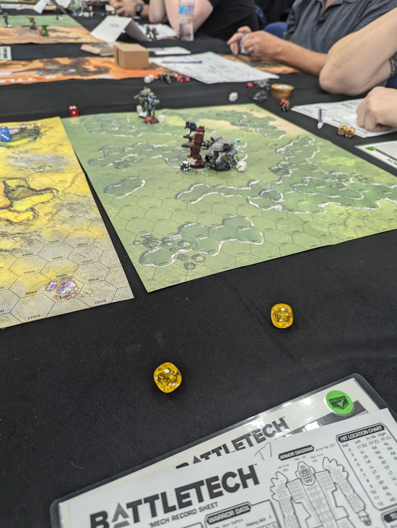 Photo showing our game board for classic battletech and a pair of snake eyes I rolled. It's a shame I never took down a mech that match!