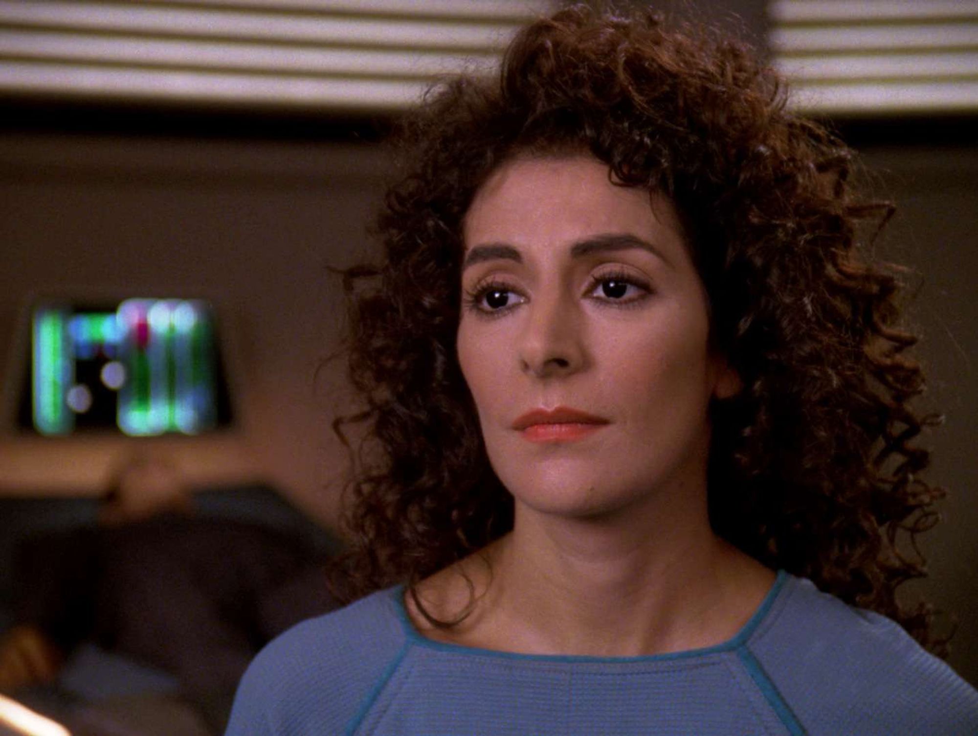 Troi in sick bay, facial implants removed.