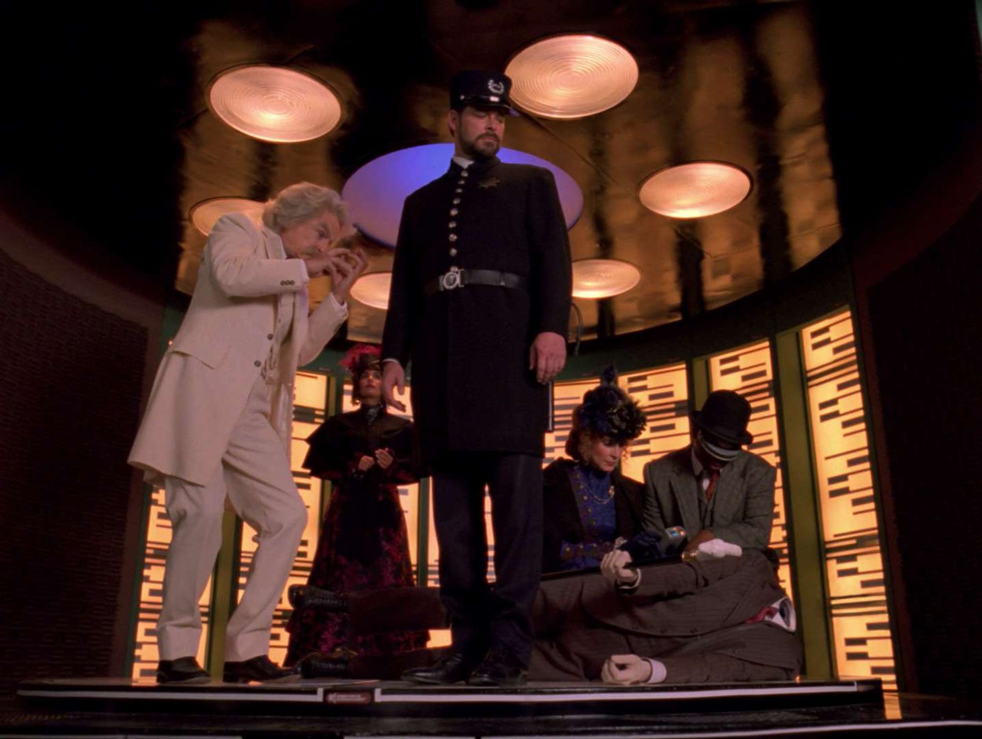 Mark Twain on the transporter pad, with the rest of the crew in Victorian dress, including Riker as a cop. ACAB