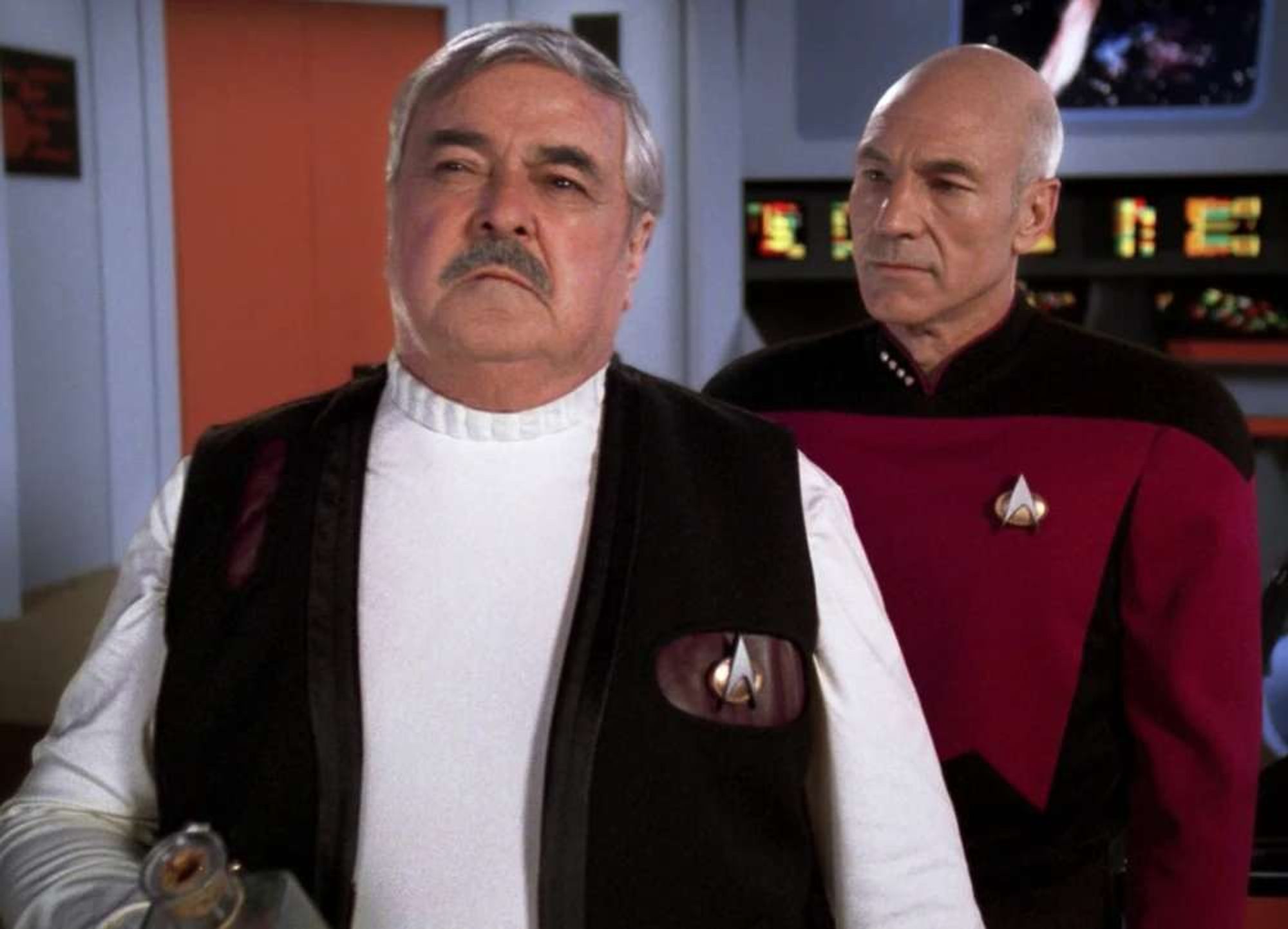 Scotty on the bridge of the Enterprise from the Original 60s Series with Picard looking on.