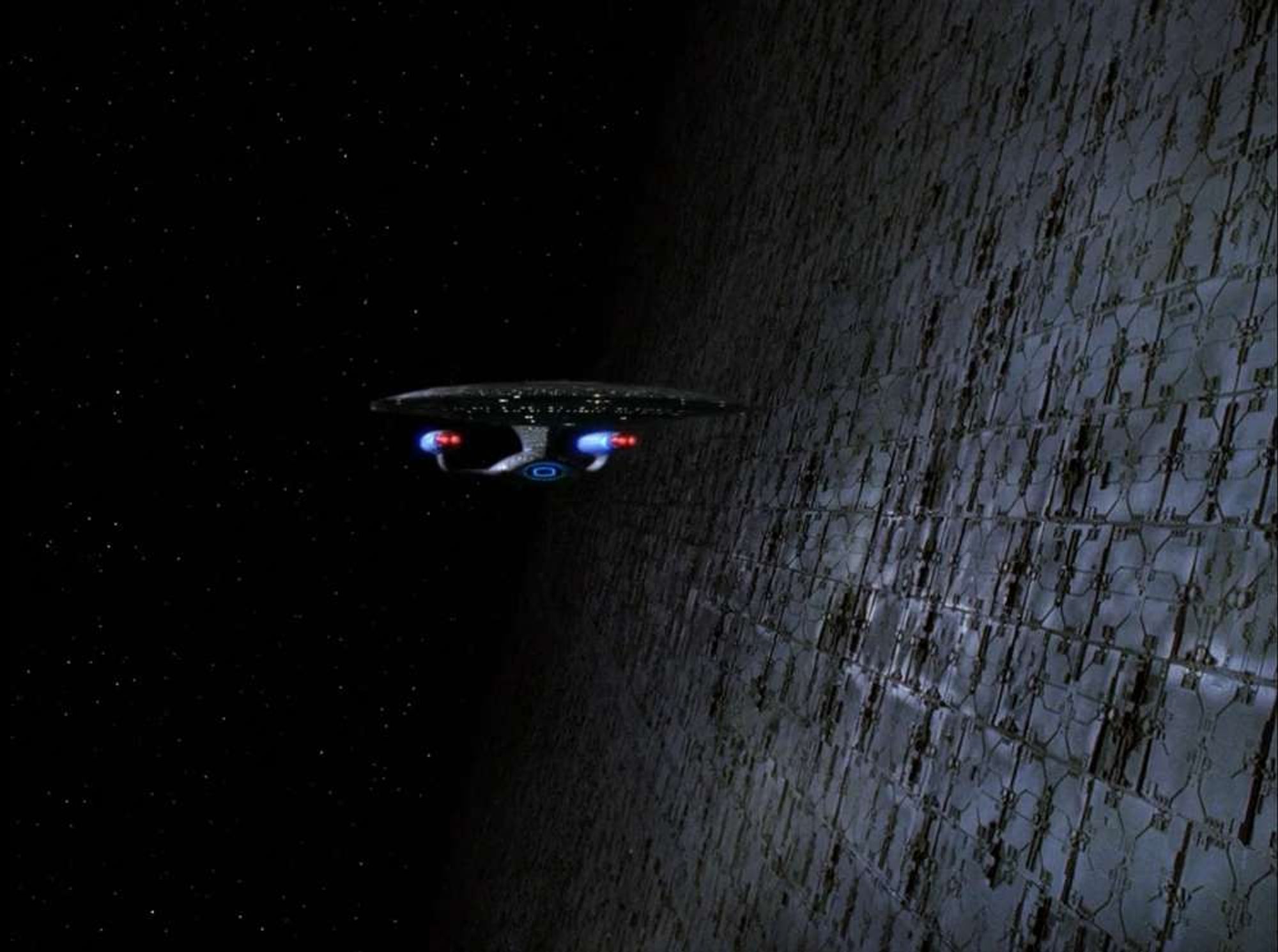 The Enterprise D orbiting a HUGE sphere of metal.