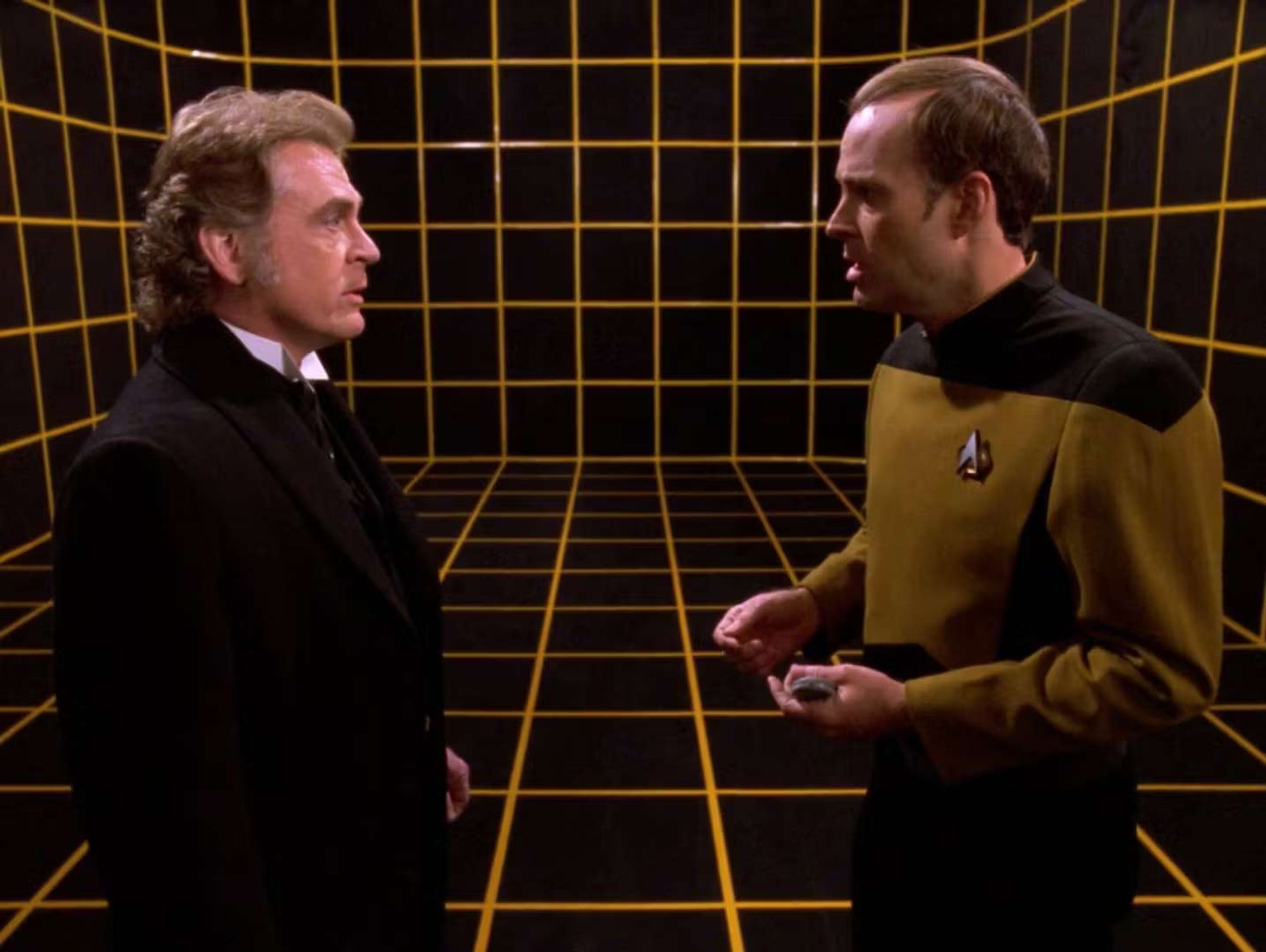 Moriarty and Barclay in the empty holodeck, yellow grid on black box background.