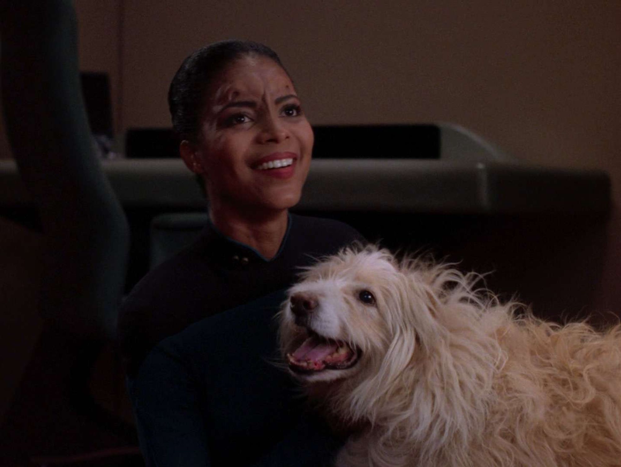 Ensign Acquiel with a shaggy dog.