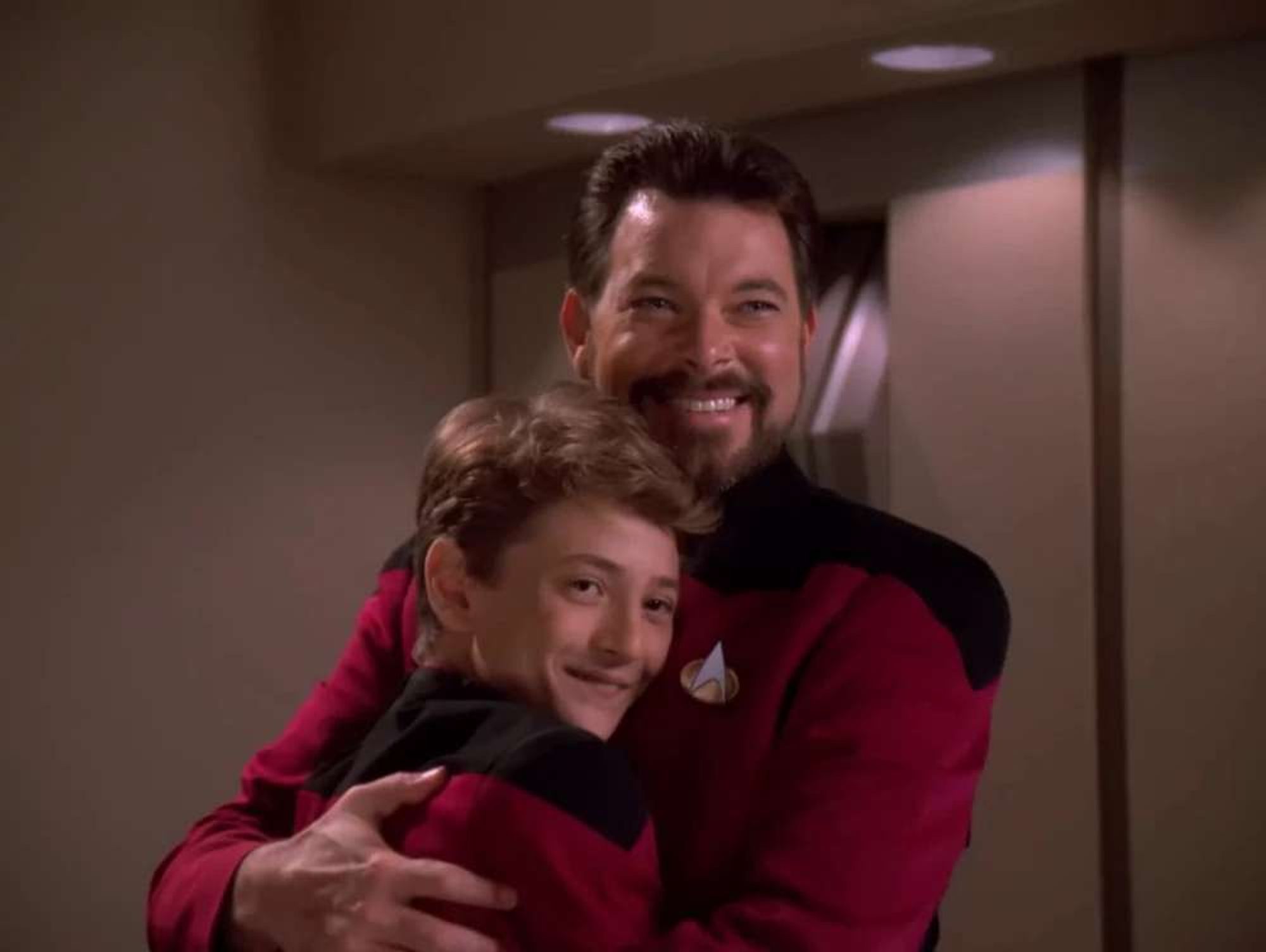 Young Picard hugging Riker. "He's my number one dad!"