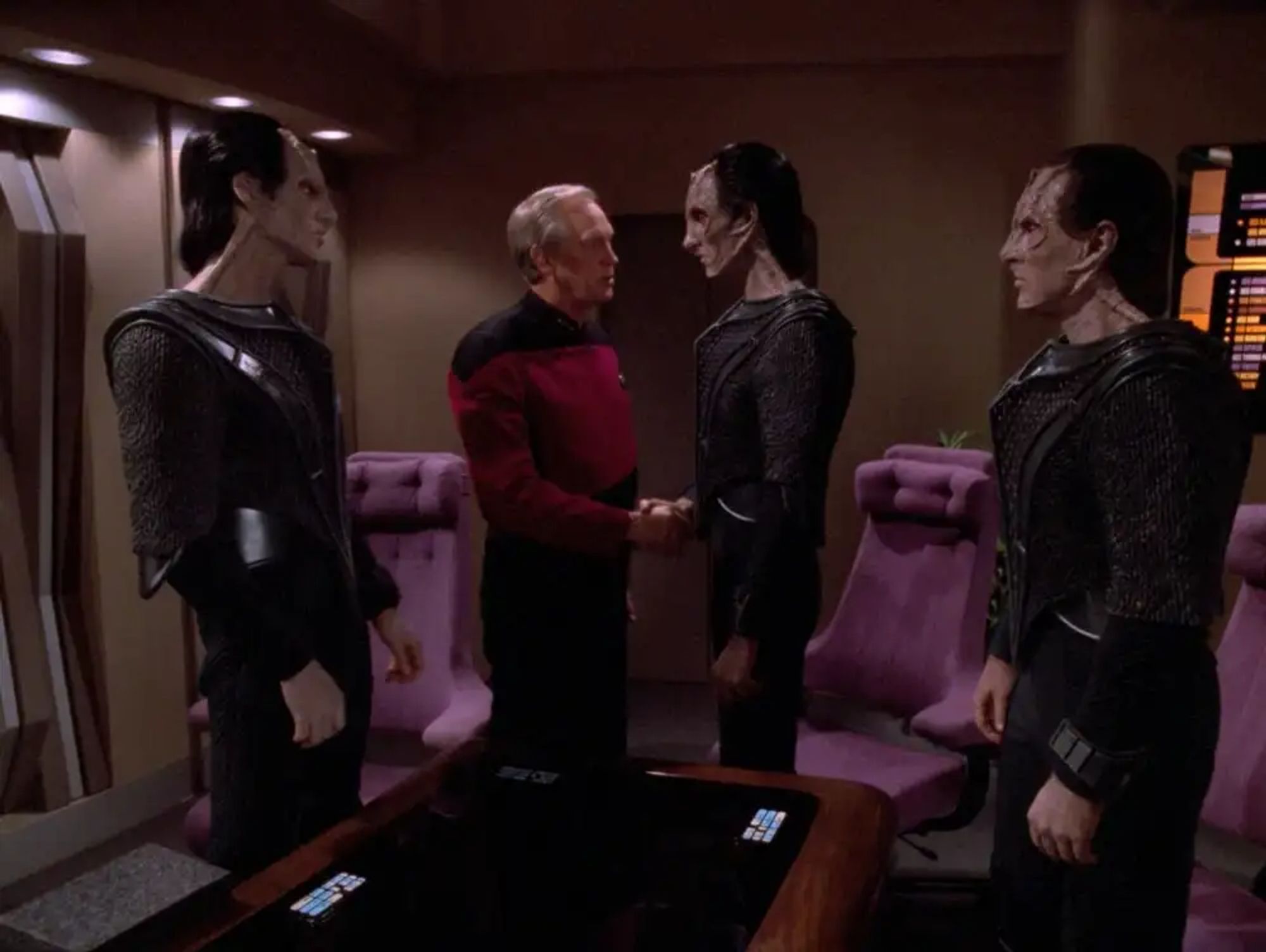 Jellico welcoming the Cardassian delegation aboard the Enterprise for negotiation.