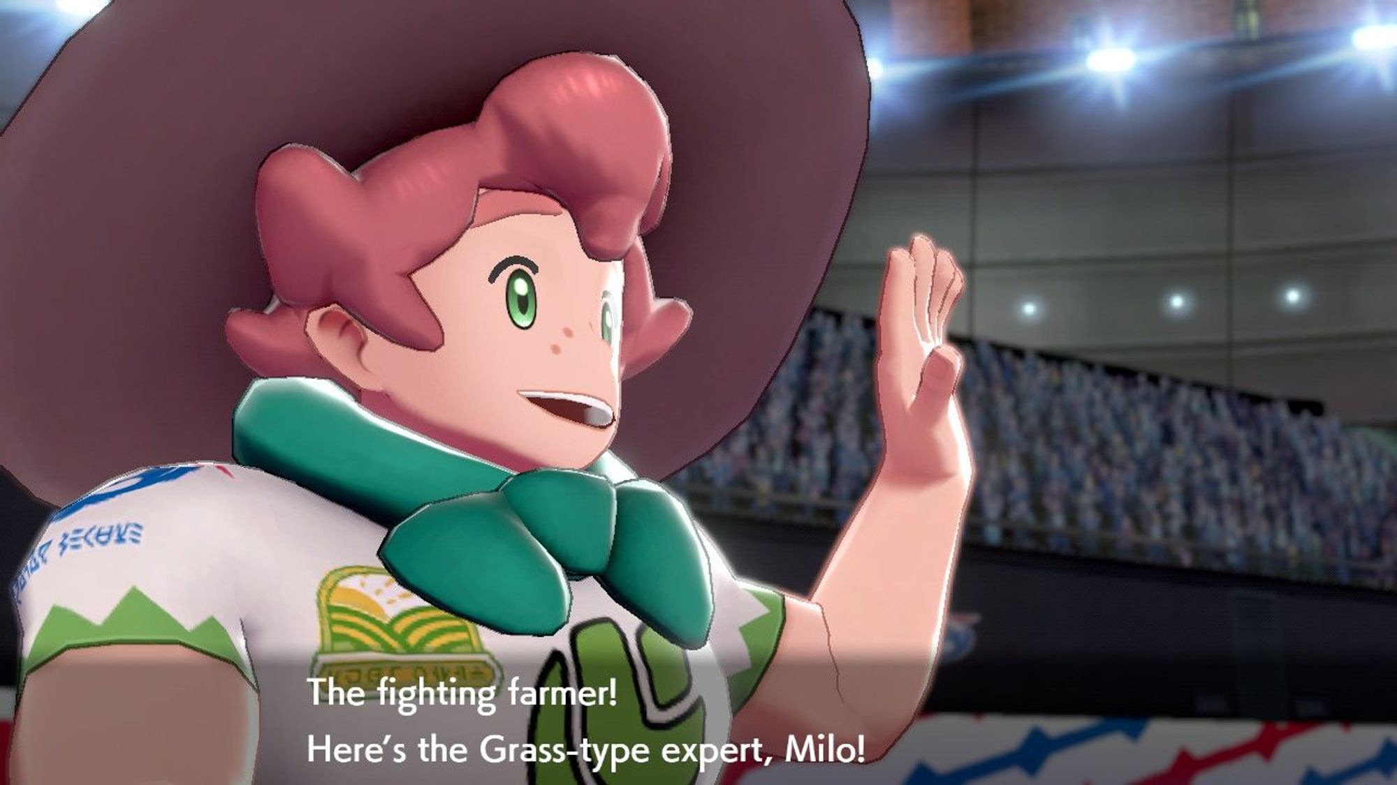 A screenshot from Pokémon Shield. Milo, the Grass-type gym leader, is waving at the crowd. #pokémon #milo #nintendo #nintendoswitch #gaymer #gamer #geek #nerd #gaygeek #gaynerd