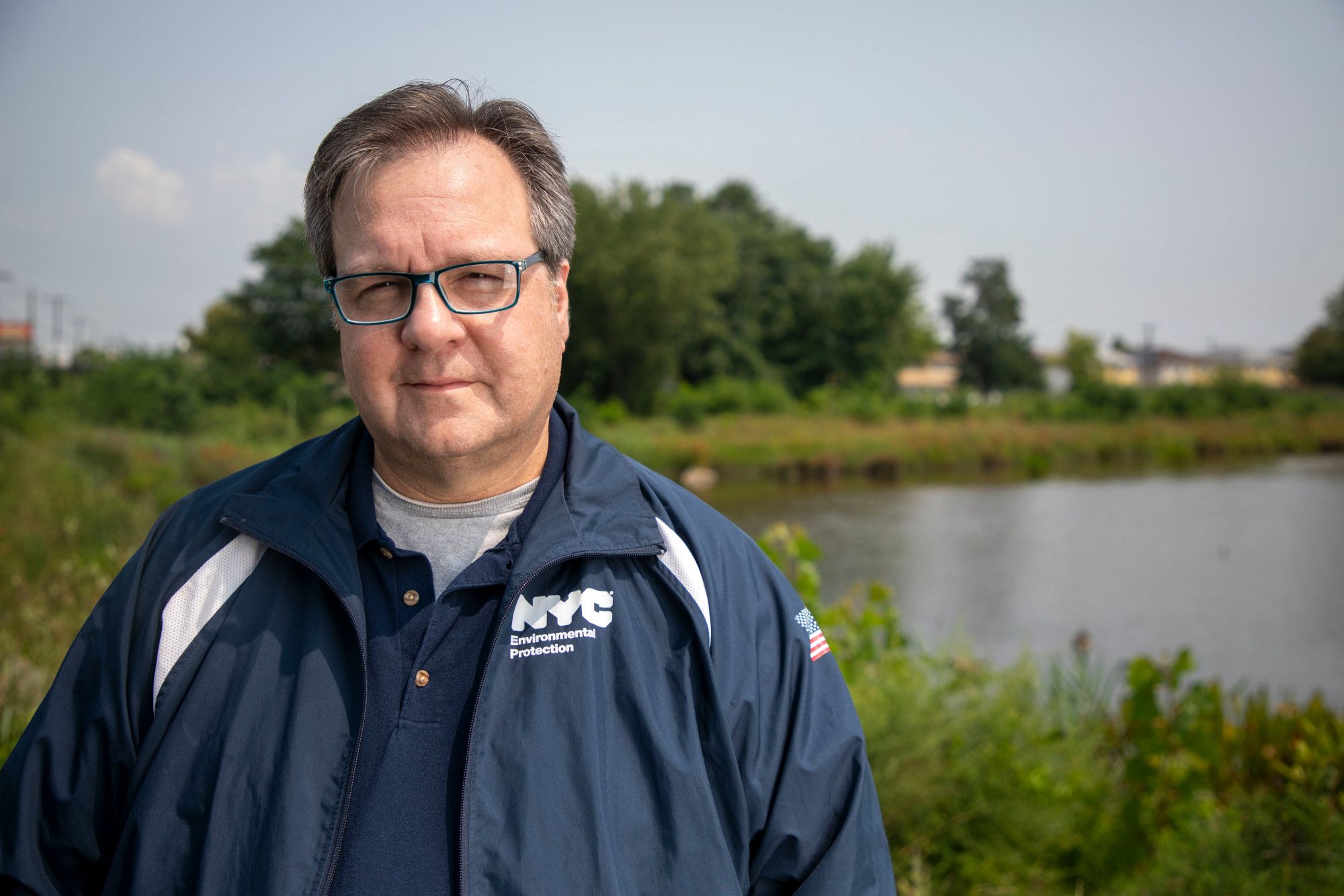 Mario Bruno stands in front of a Staten Island Bluebelt