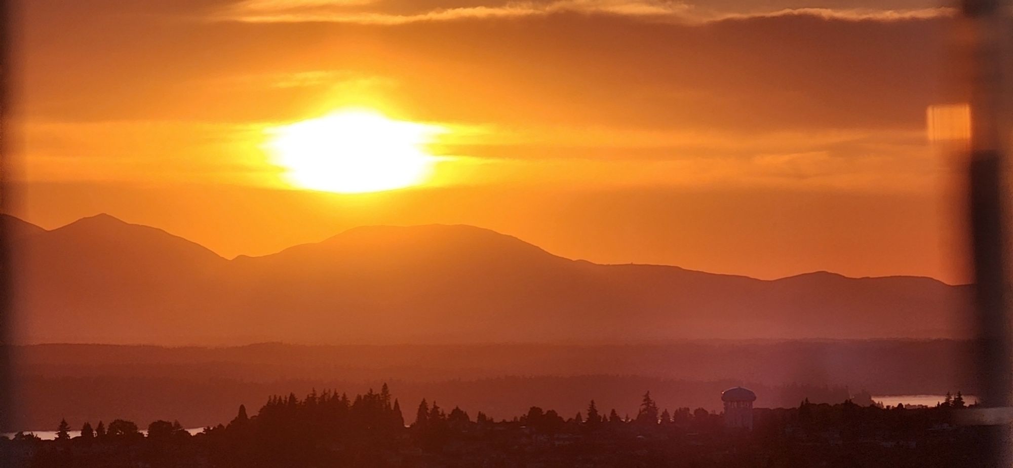 Sunset view of Olympics from top of Space Needle