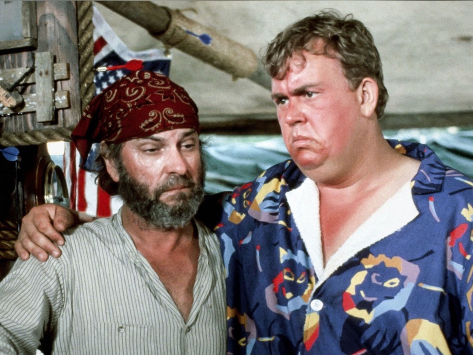 Rip Torn as Scully and John Candy as Jack Chester in Summer Rental (1985)