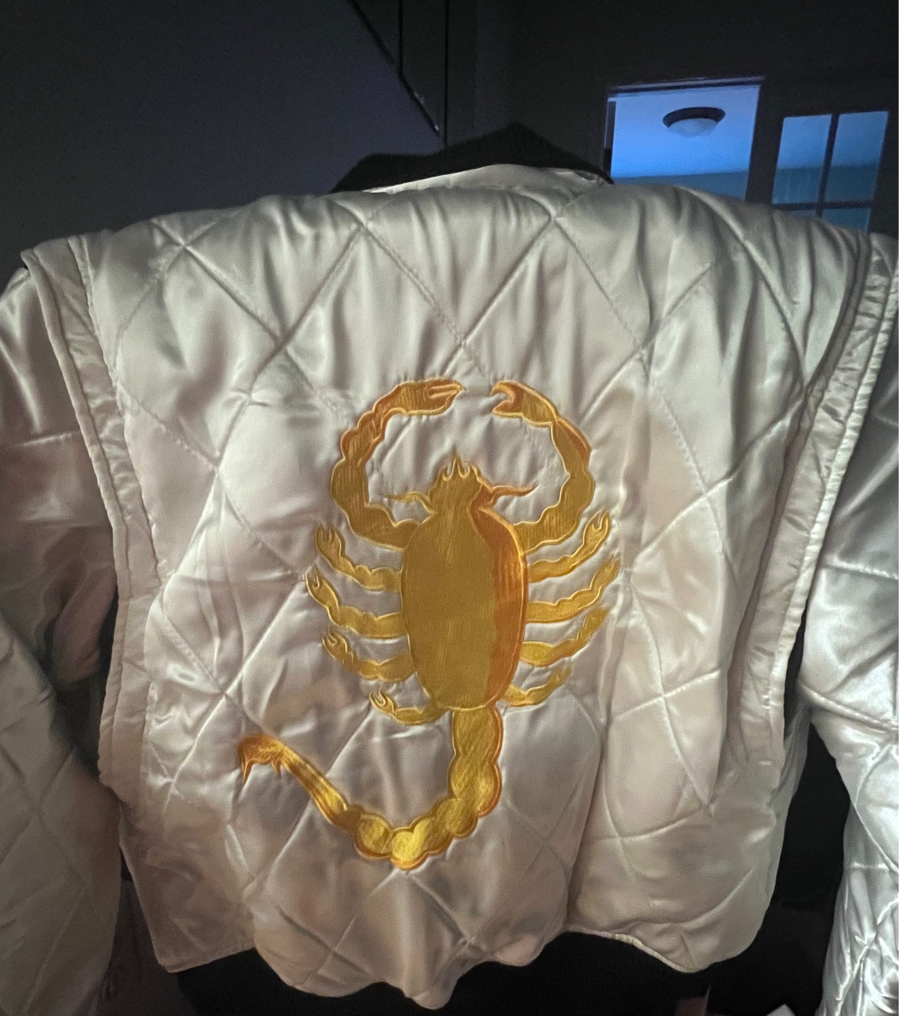 replica of ryan gosling’s white and gold scorpion jacket from the 2011 movie “drive”