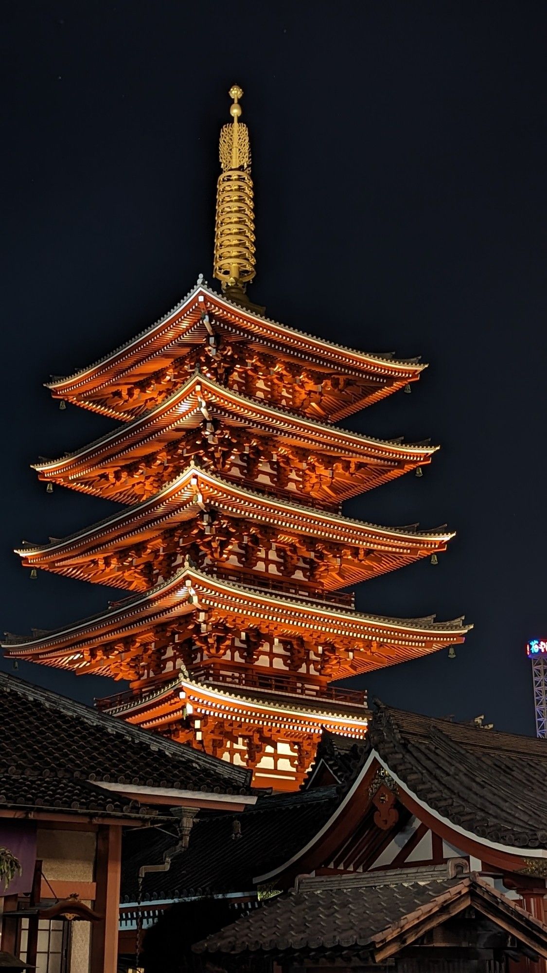 Two Buddhas, towers at night, Tokyo Japan