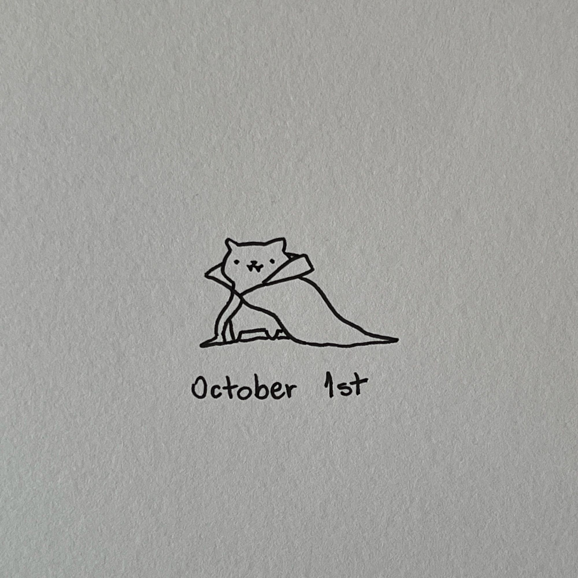 a poorly drawn vampire cat, it looks very amused because it’s finally October (below it, it’s written: October 1st)