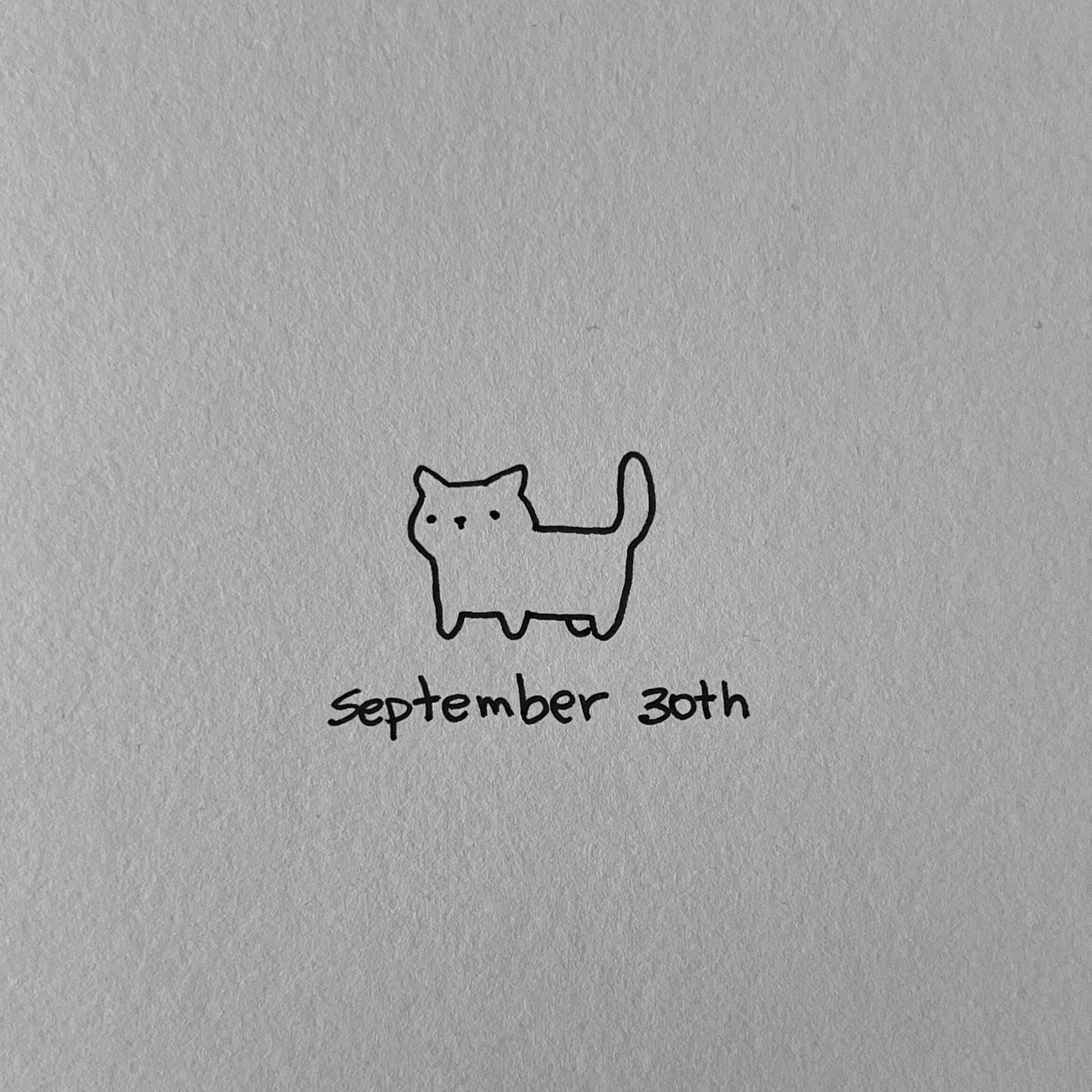 a poorly drawn cat with a blank expression, it’s sad because it’s still not October (below it, it’s written: September 30th)