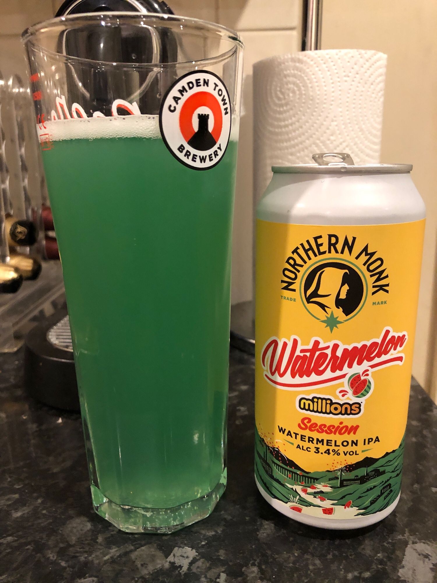 A tall class contains a greenish-blue drink. A can stands next to it labelled Watermelon Millions Session IPA from Northern Monk.