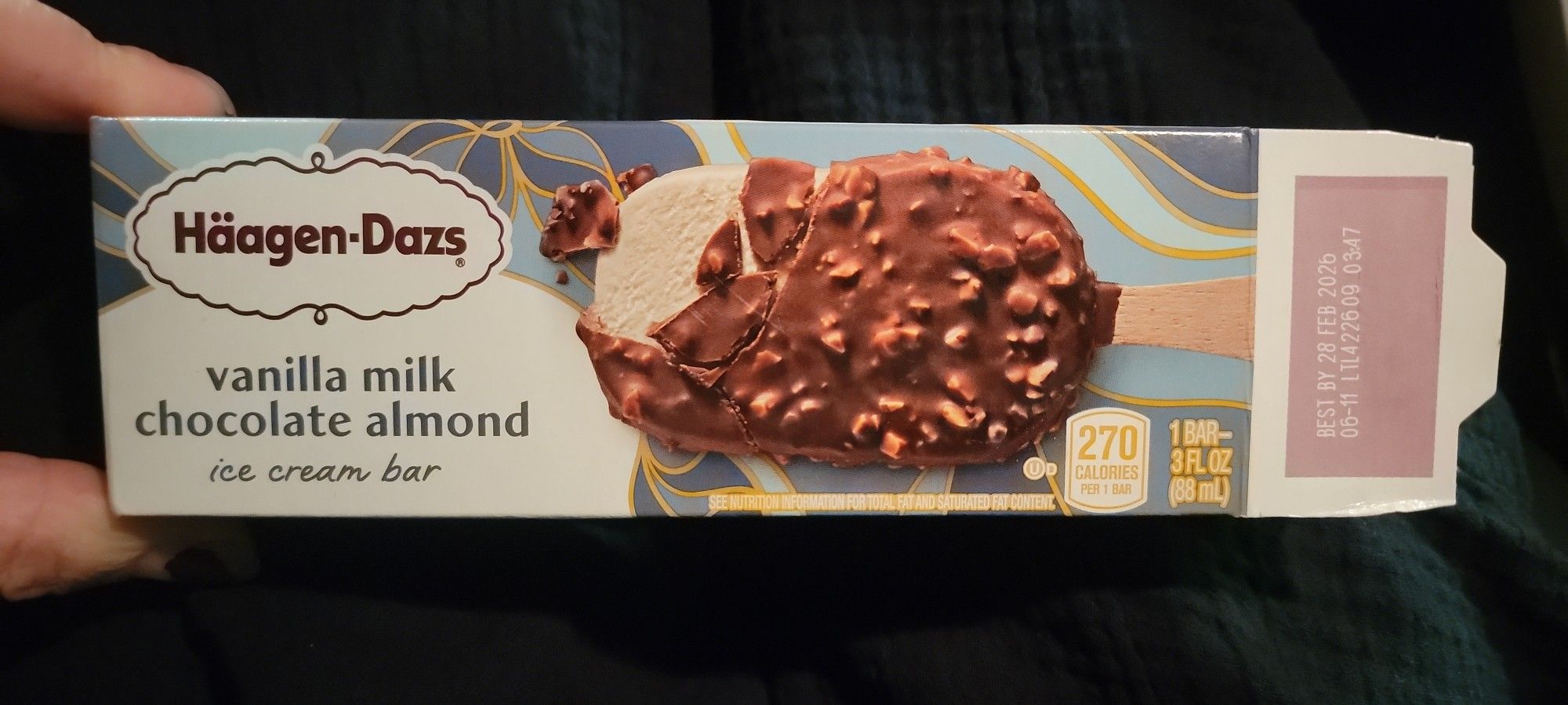 A Häagen-Dazs vanilla milk chocolate almond ice cream bar