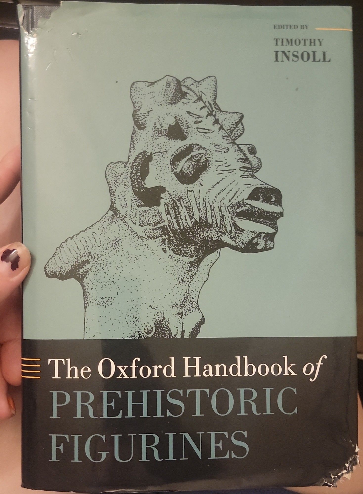 A picture of a book entitled, the Oxford handbook of prehistoric figurines, by Timothy Insoll