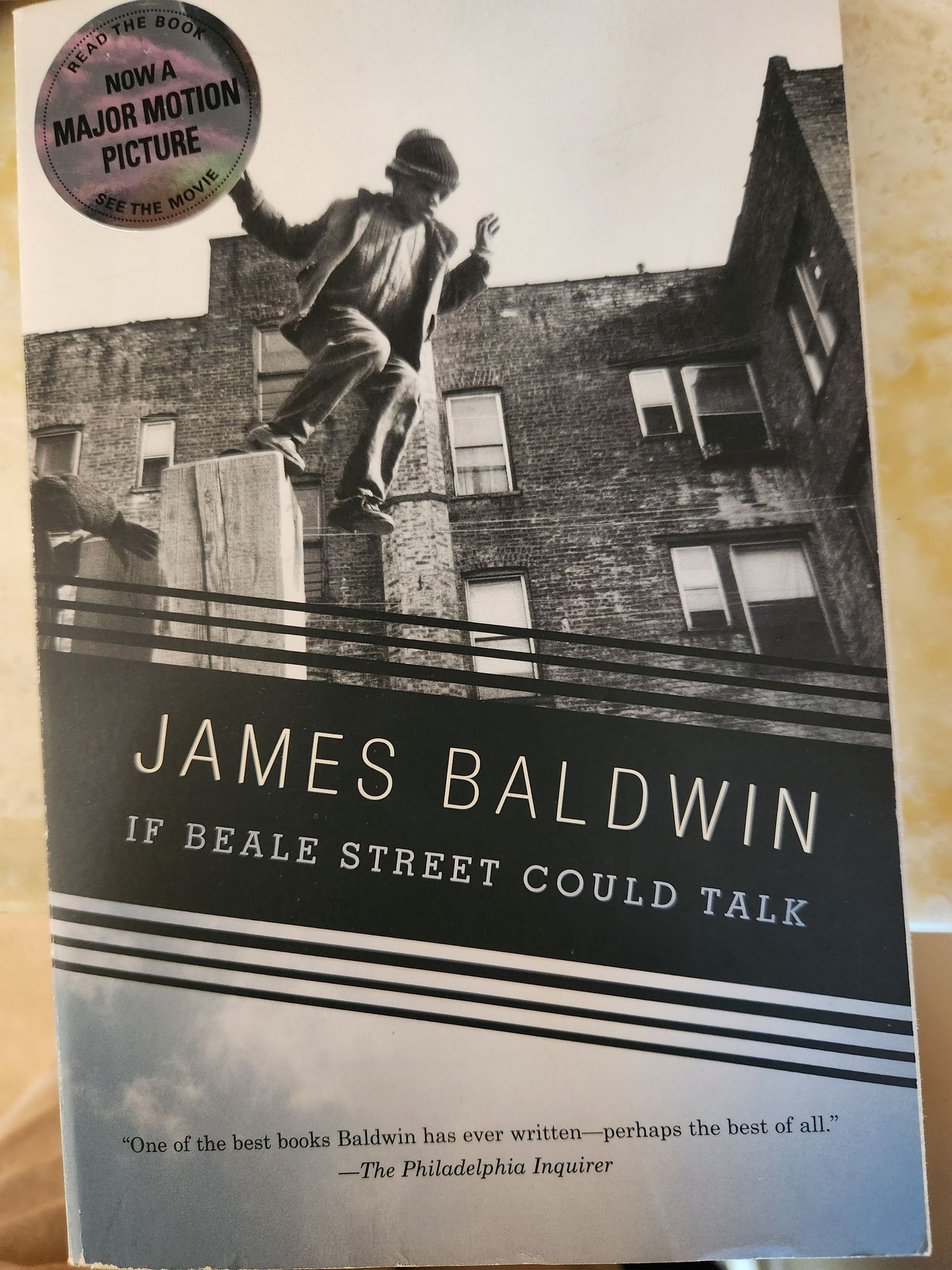 Book cover: James Baldwin, If Beale Street Could Talk. Picture of Black child with city buildings in the background.