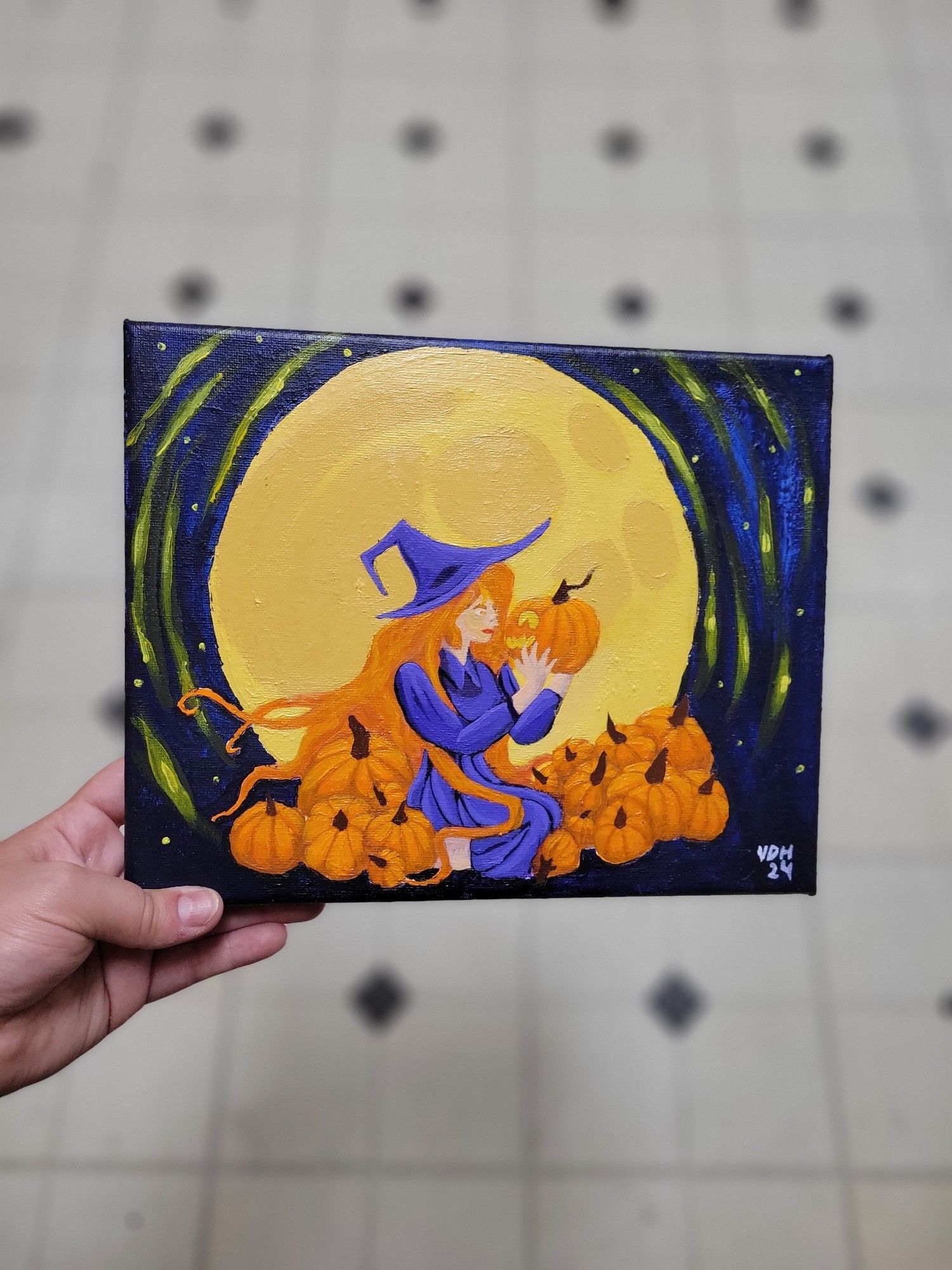 A finished painting of a orange haired witch wearing a purple dress sitting in a pile of orange pumpkins. Behind her a large glowing full moon and small stars surround her.