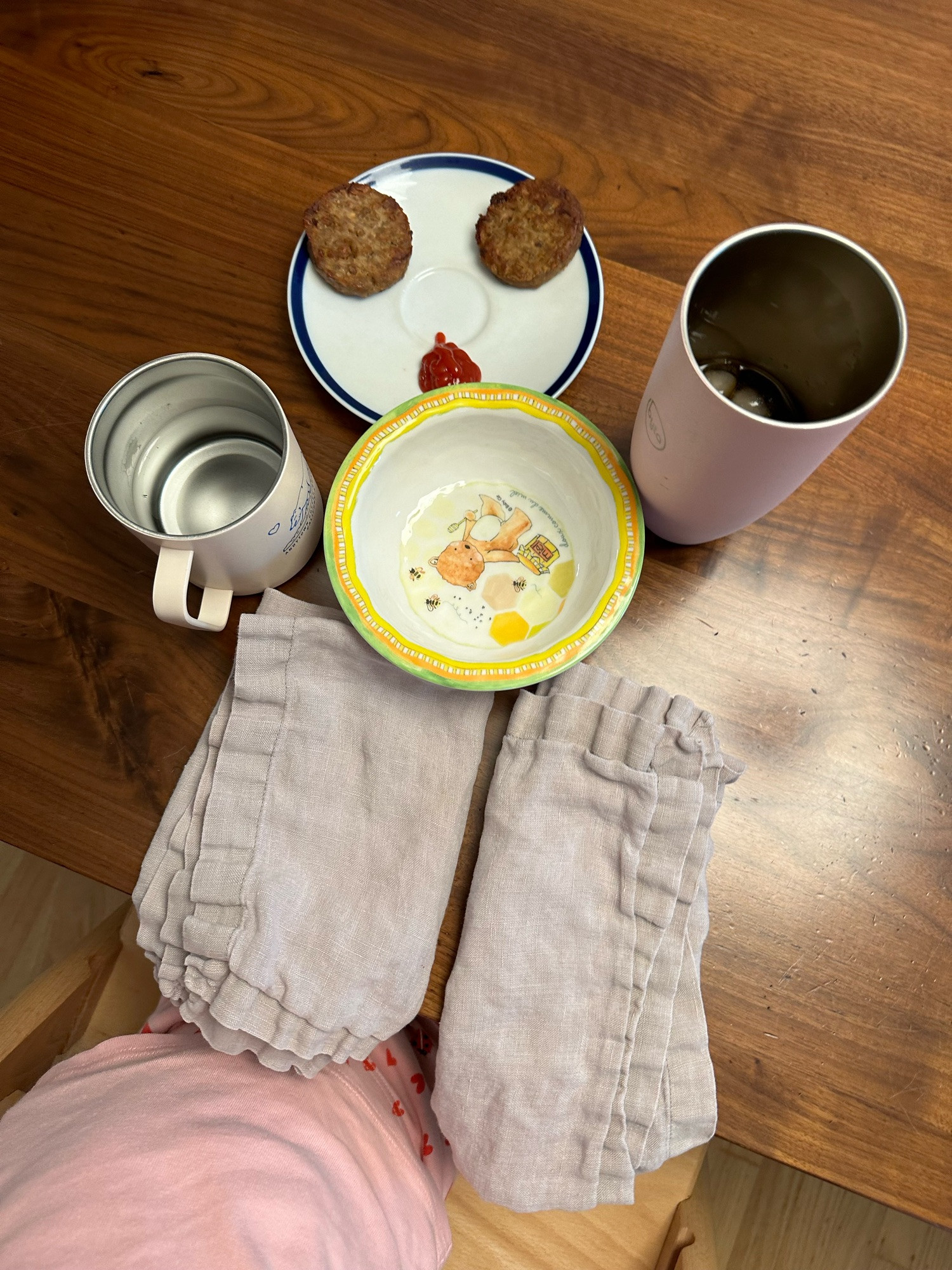 Various breakfast items and dishes arranged into a vaguely person-shaped tableau