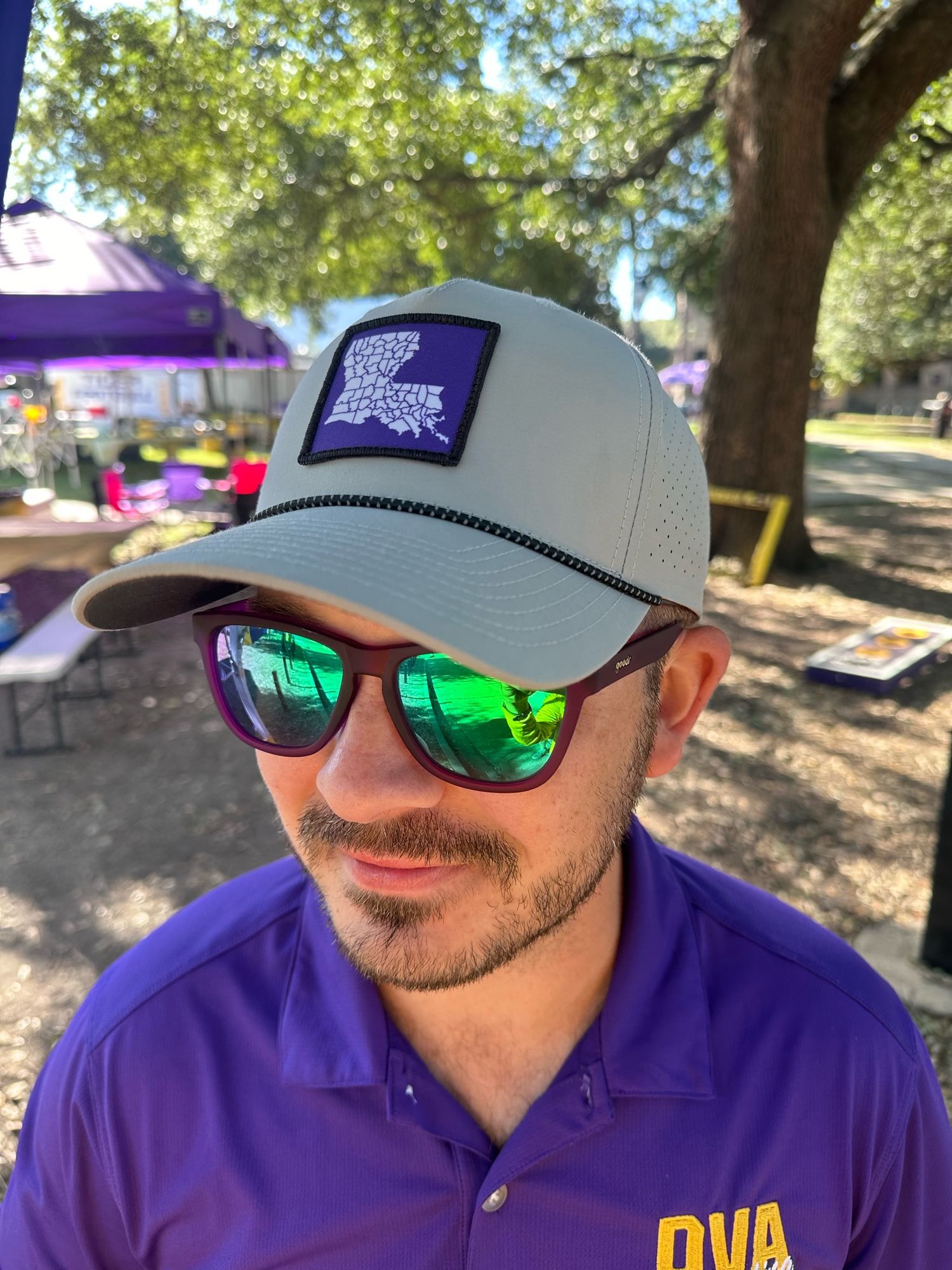 Copilot Joey wears the gray LA by Parishes hat with green mirrored sunglasses and a purple polo on a glorious Saturday morning