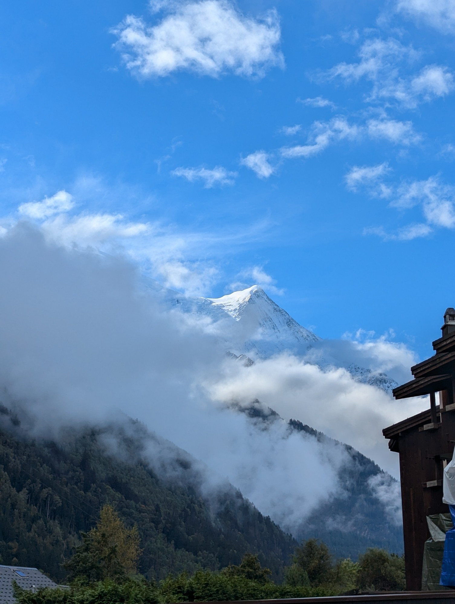 The peak of Mont Blanc under a blue sky.