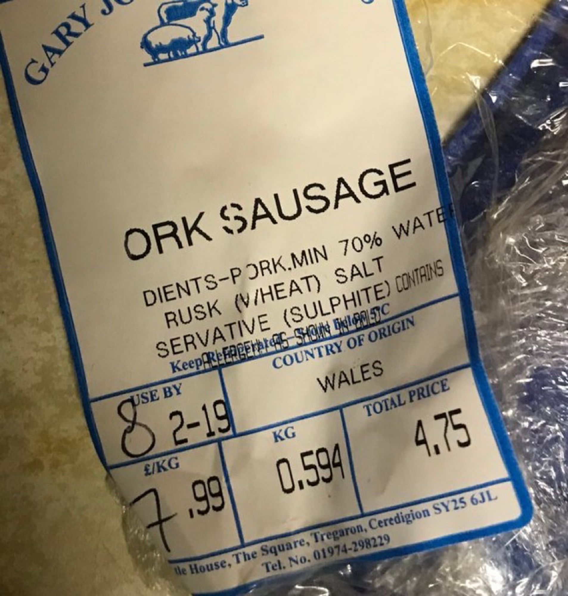 A misprinted butcher label that reads “ORK SAUSAGE”