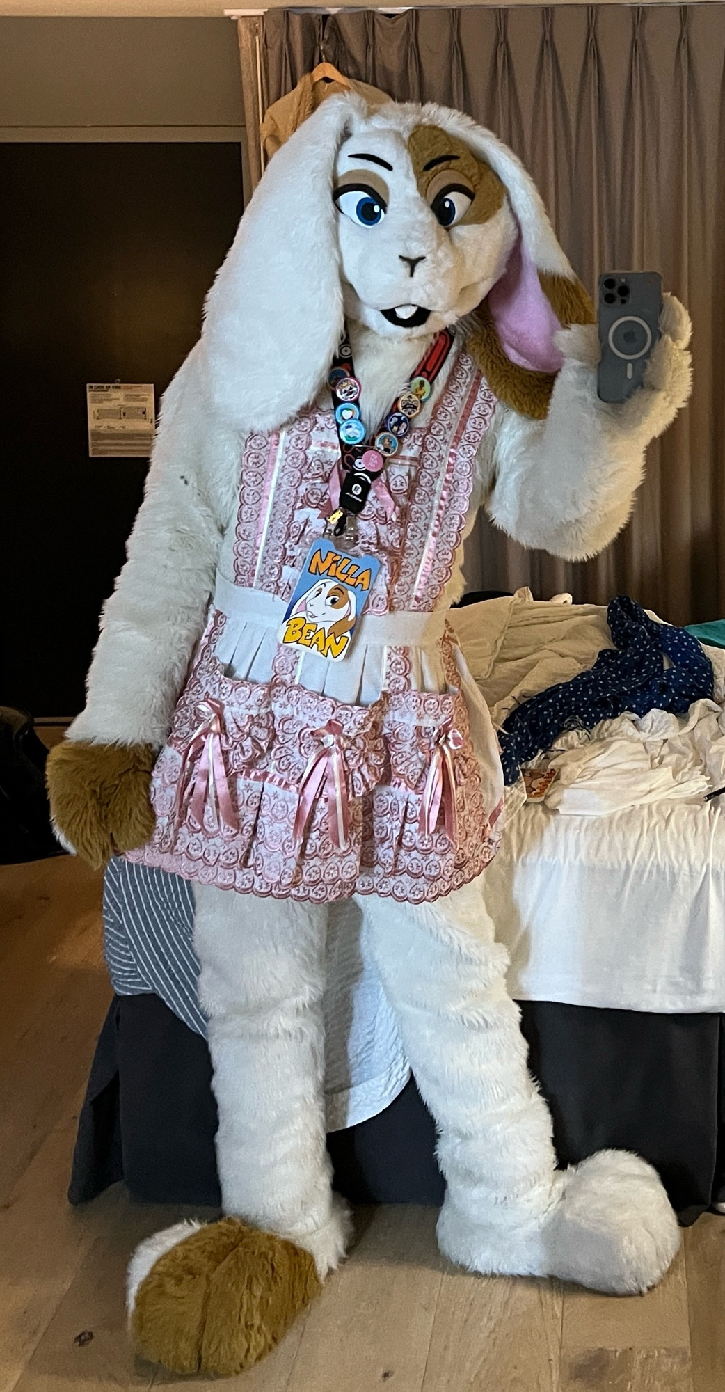 Nilla bean, white with brown accents lop-eared bunny fursuit by Lacy (2009) wearing a pink and white frilly apron