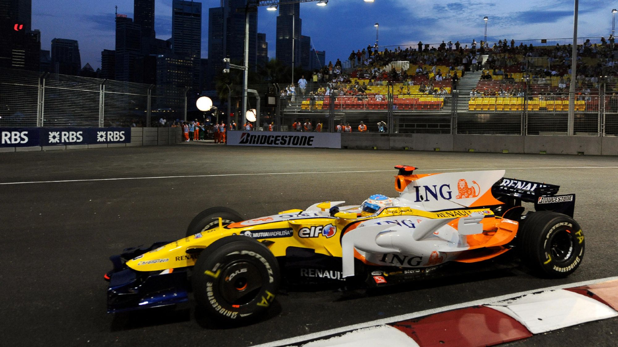 Picture of Fernando Alonso in a R28 driving around a corner.